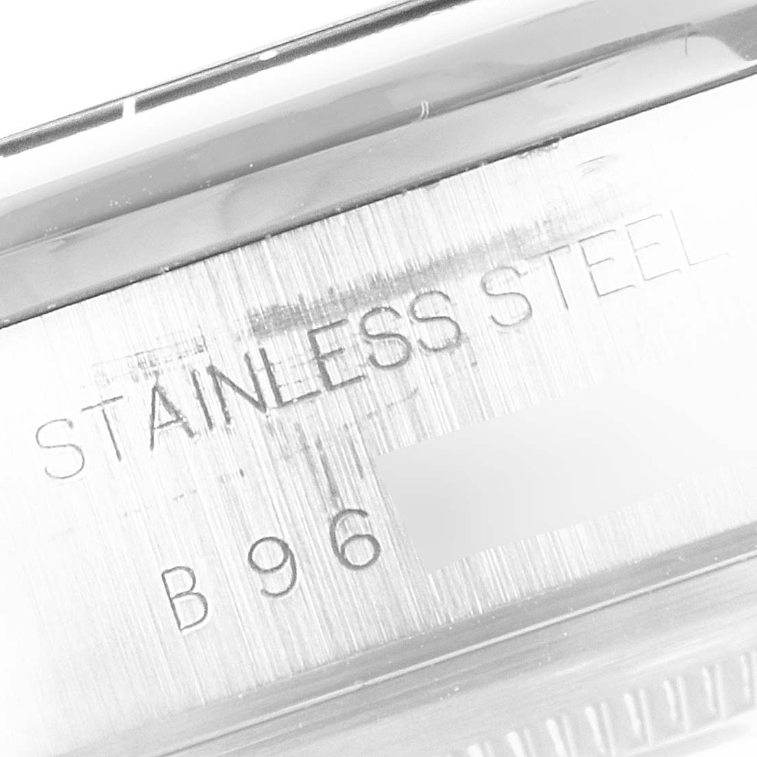 The image shows a close-up of the engravings on the stainless steel case back of the Tudor Tiger 79260 Men's Stainless Steel Yellow Dial 79260 Men's Stainless Steel Yellow Dial model watch.