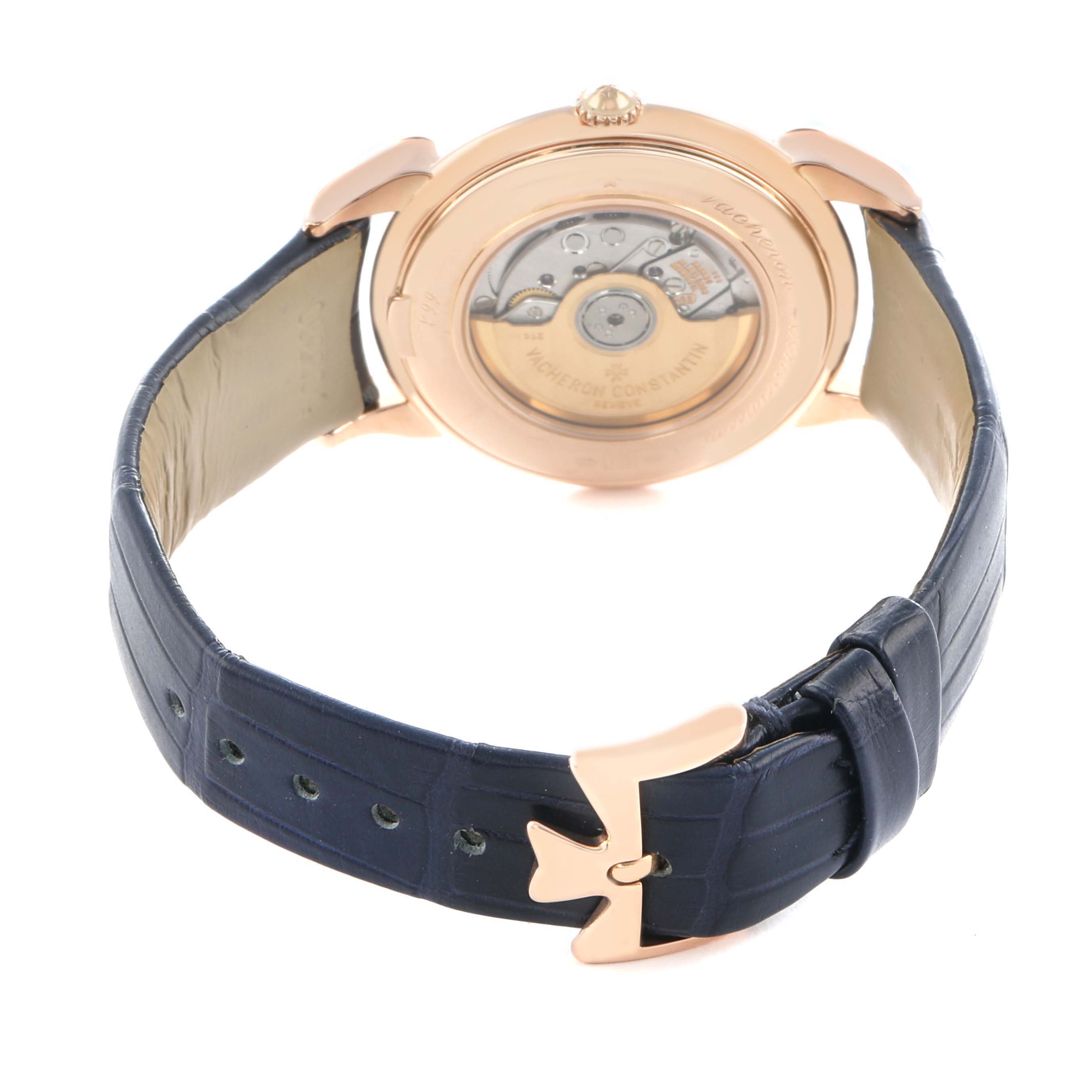 The Vacheron Constantin Historiques 48001R Men's Rose Gold White Dial watch is shown from the back, highlighting the movement and blue leather strap.