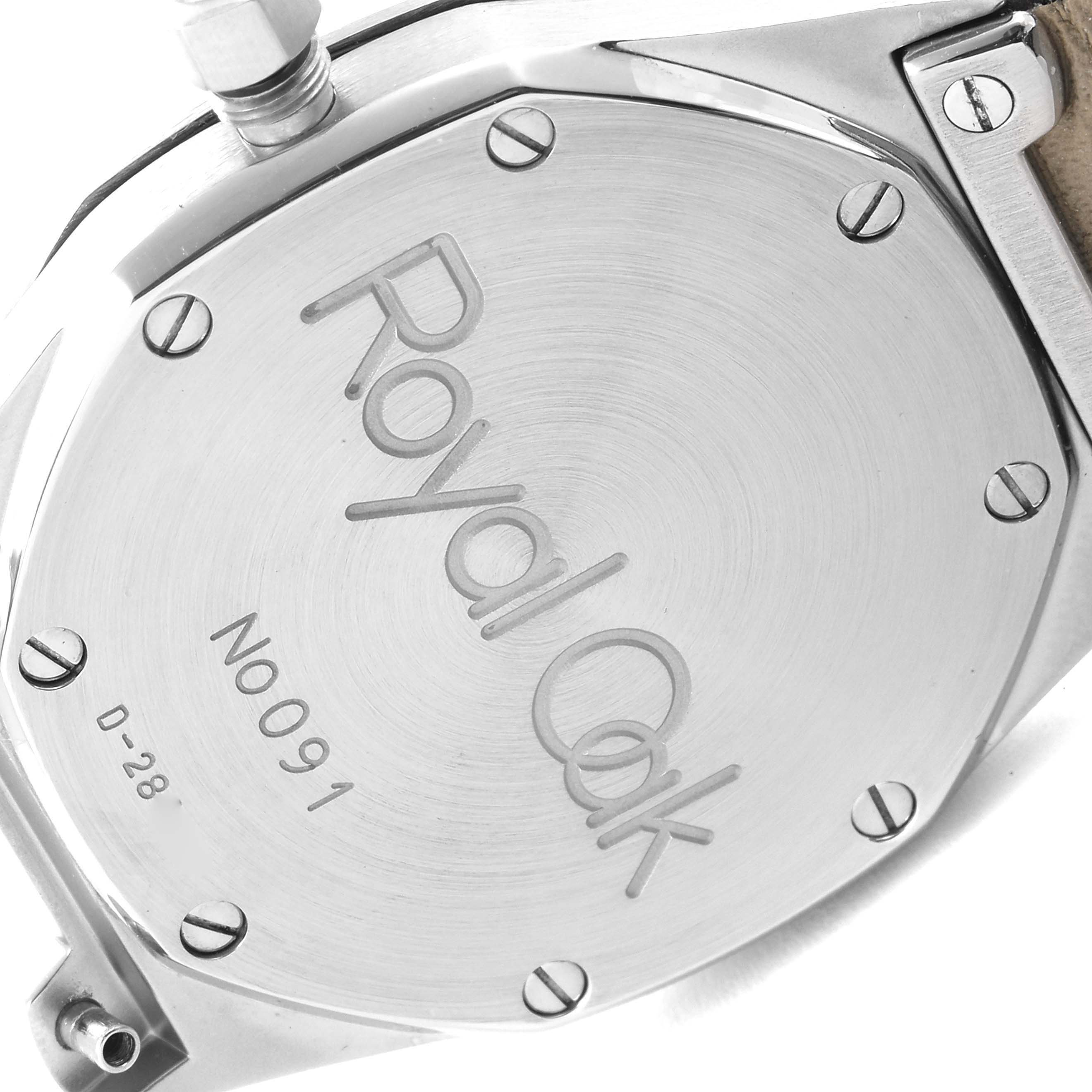 The image shows the case back of an Audemars Piguet Royal Oak 14800ST Men's Stainless Steel Black Dial 14800ST Men's Stainless Steel Black Dial watch, highlighting the engraved text and screws.