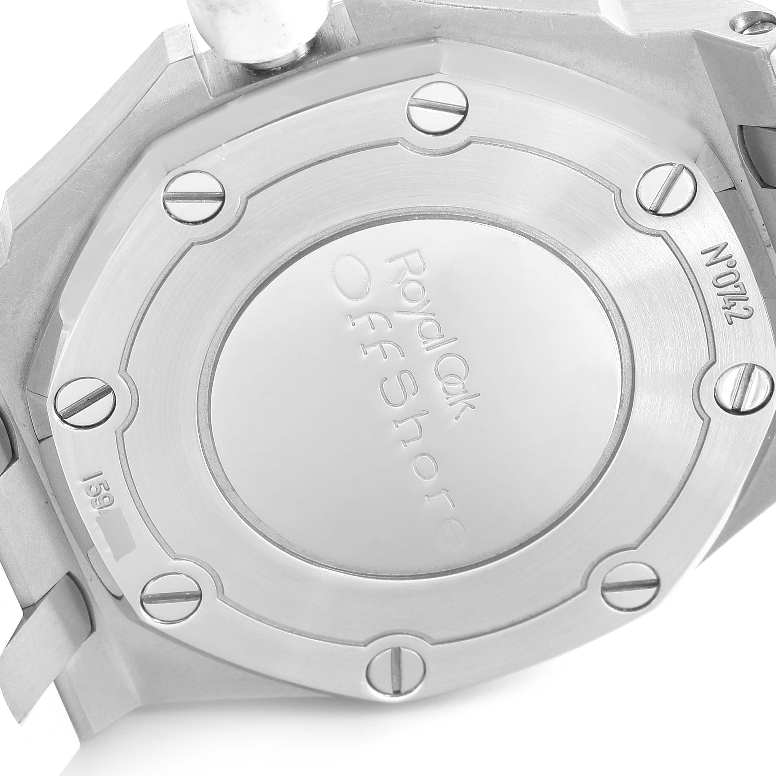 The image shows the case back of an Audemars Piguet Royal Oak Offshore 67540SK.ZZ.A010CA.01 Women's Stainless Steel Silver Dial 67540SK.ZZ.A010CA.01 Women's Stainless Steel Silver Dial model, displaying its engravings and screws.