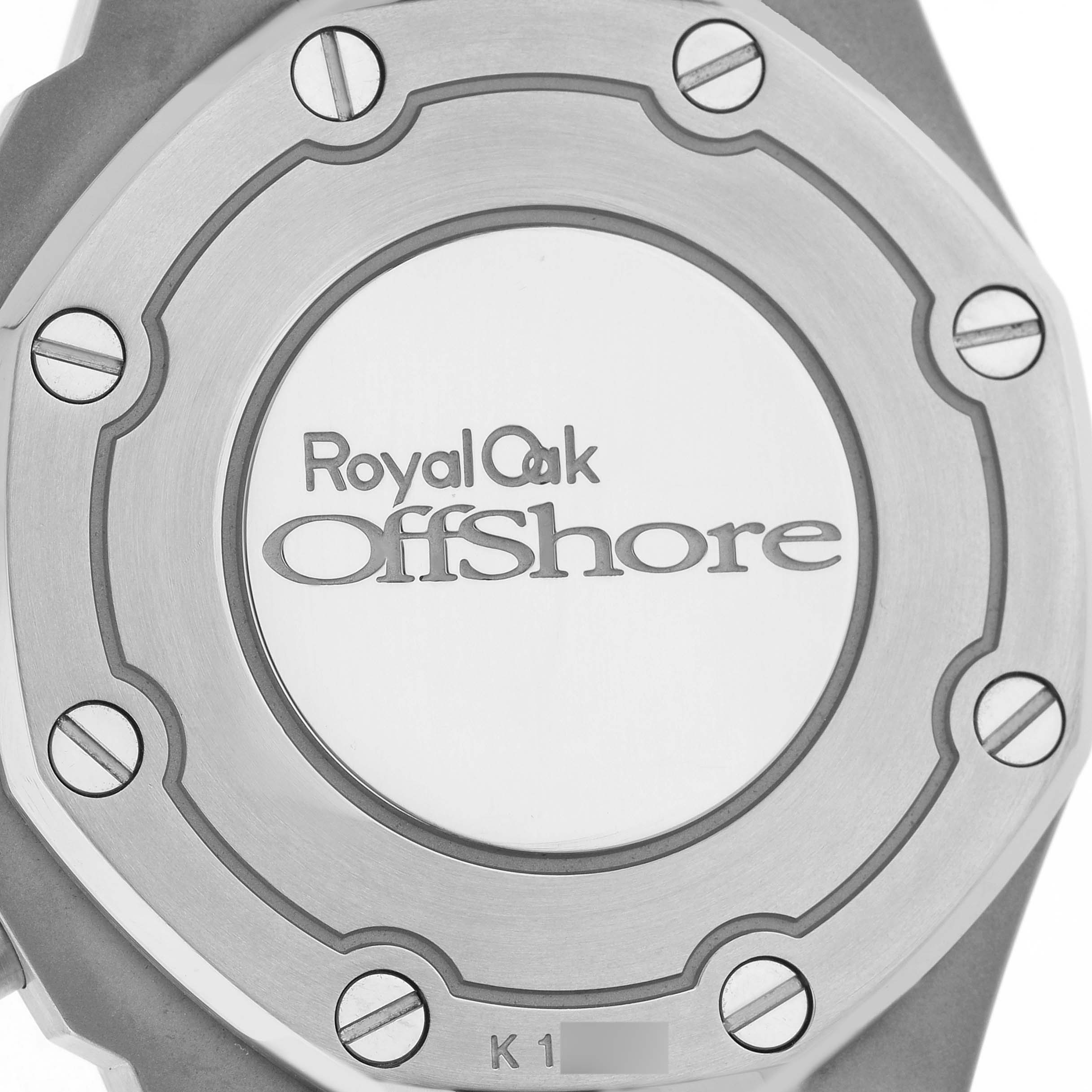 The image shows the back case of an Audemars Piguet Royal Oak Offshore 26231ST.ZZ.D027CA.01 Women's Stainless Steel Blue Dial watch with visible screws and engraving.