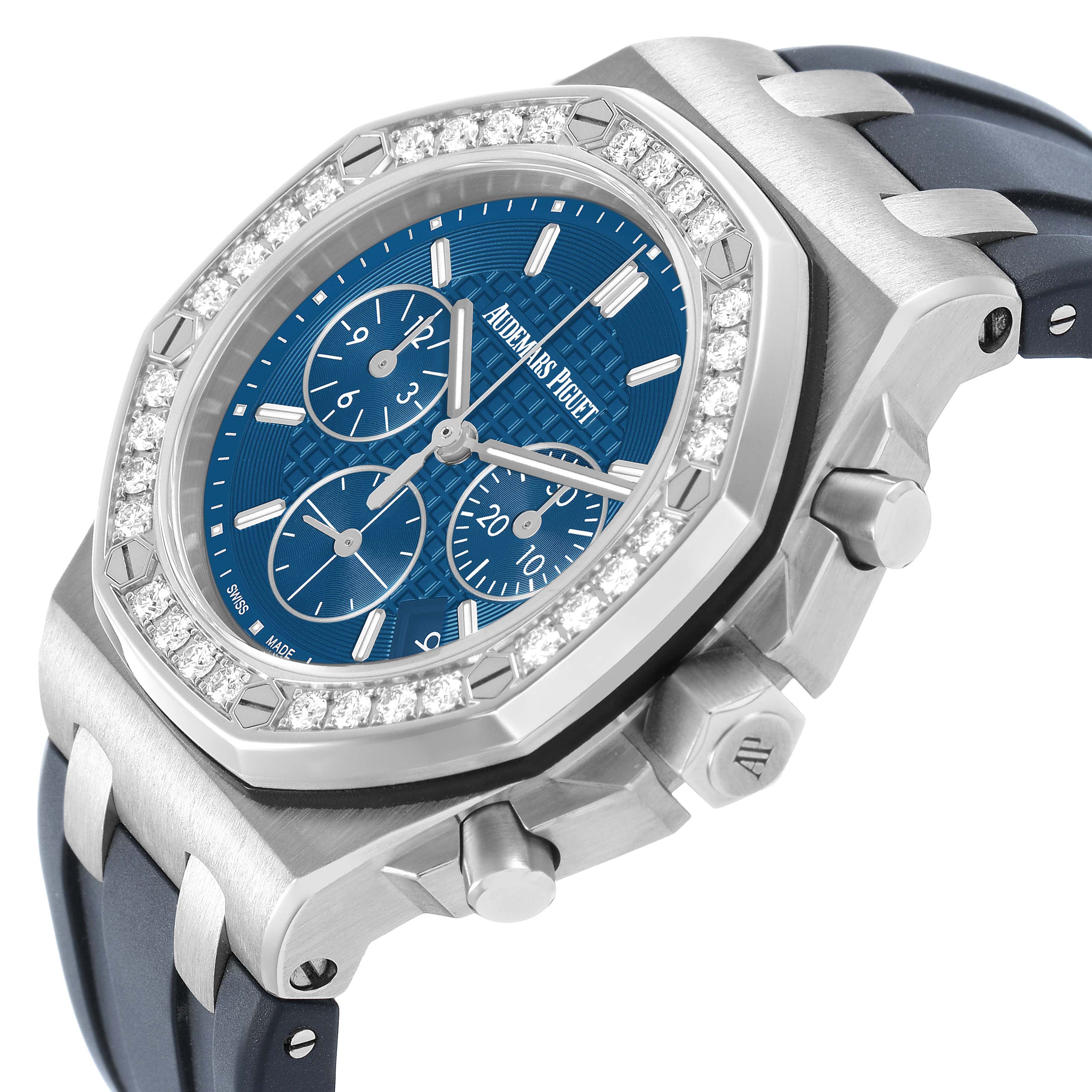 The Audemars Piguet Royal Oak Offshore 26231ST.ZZ.D027CA.01 Women's Stainless Steel Blue Dial watch is shown at an angled view highlighting its blue dial, diamond bezel, and push buttons.