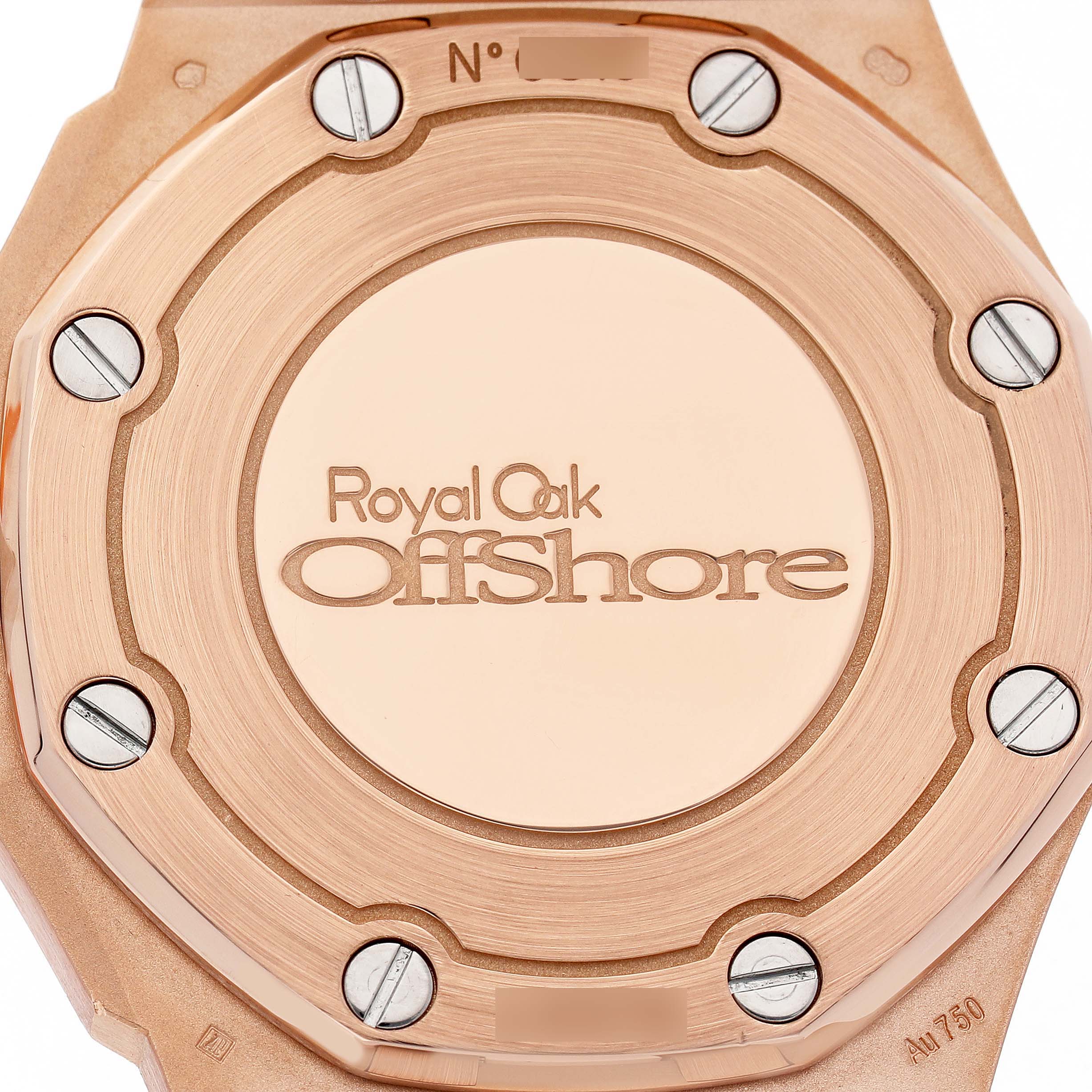The image shows the case back of an Audemars Piguet Royal Oak Offshore 67540OK.ZZ.A010CA.01 Women's Rose Gold Silver Dial watch, featuring the engraved logo and screws.