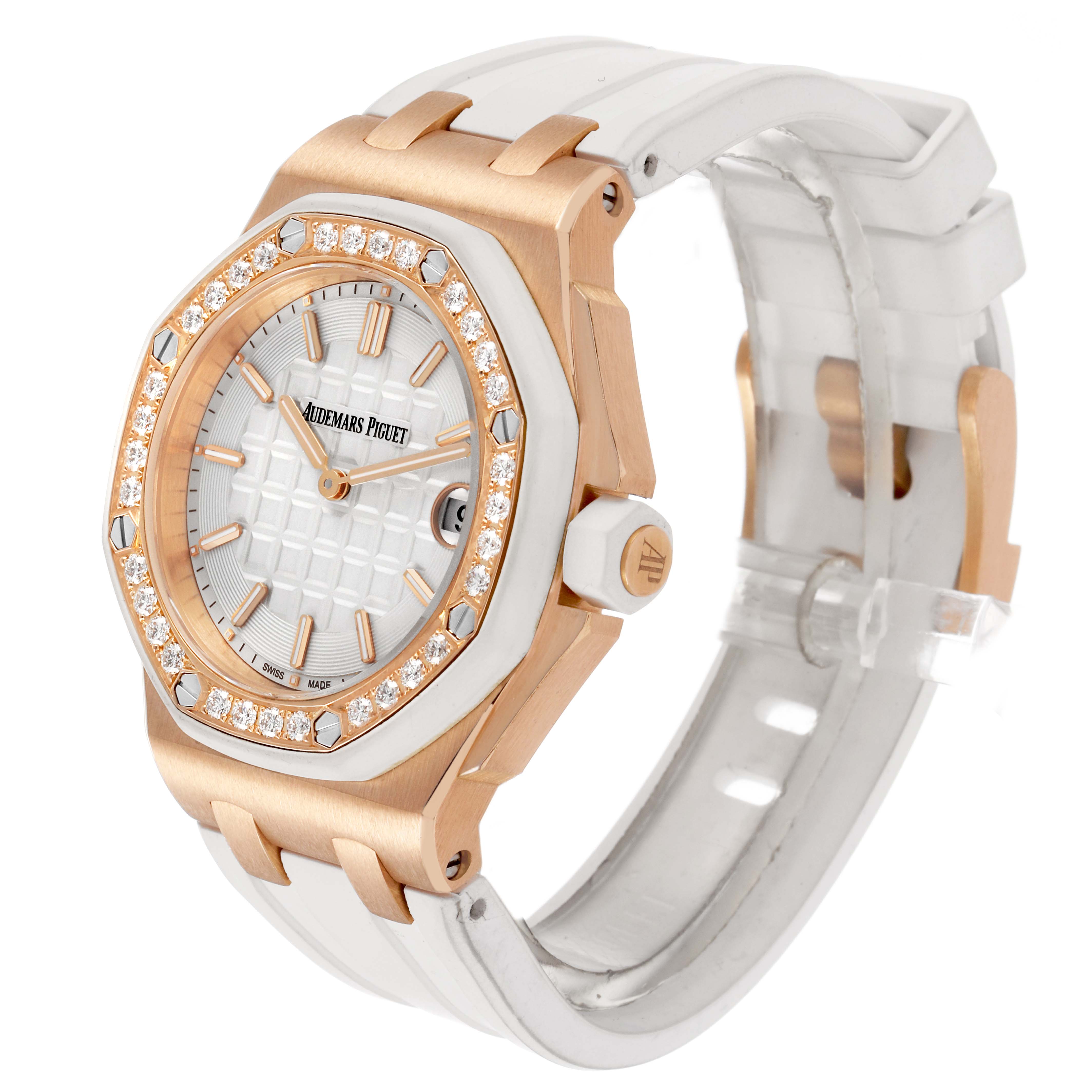 The Audemars Piguet Royal Oak Offshore 67540OK.ZZ.A010CA.01 Women's Rose Gold Silver Dial watch is shown at a three-quarter angle, highlighting the diamond-encrusted bezel, white dial, and strap.