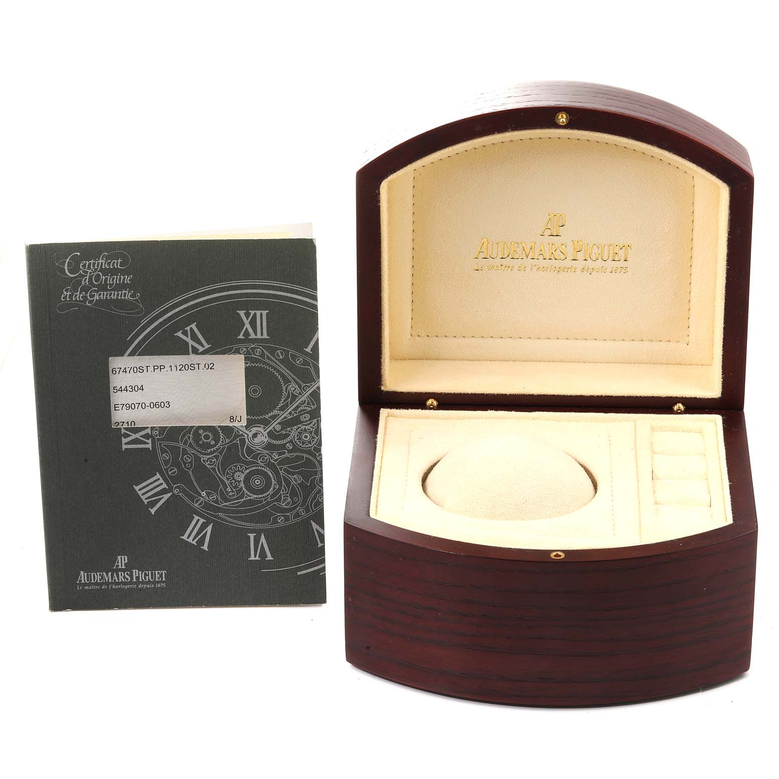 The image shows a Royal Oak by Audemars Piguet's empty watch box and a certificate of origin and warranty booklet.