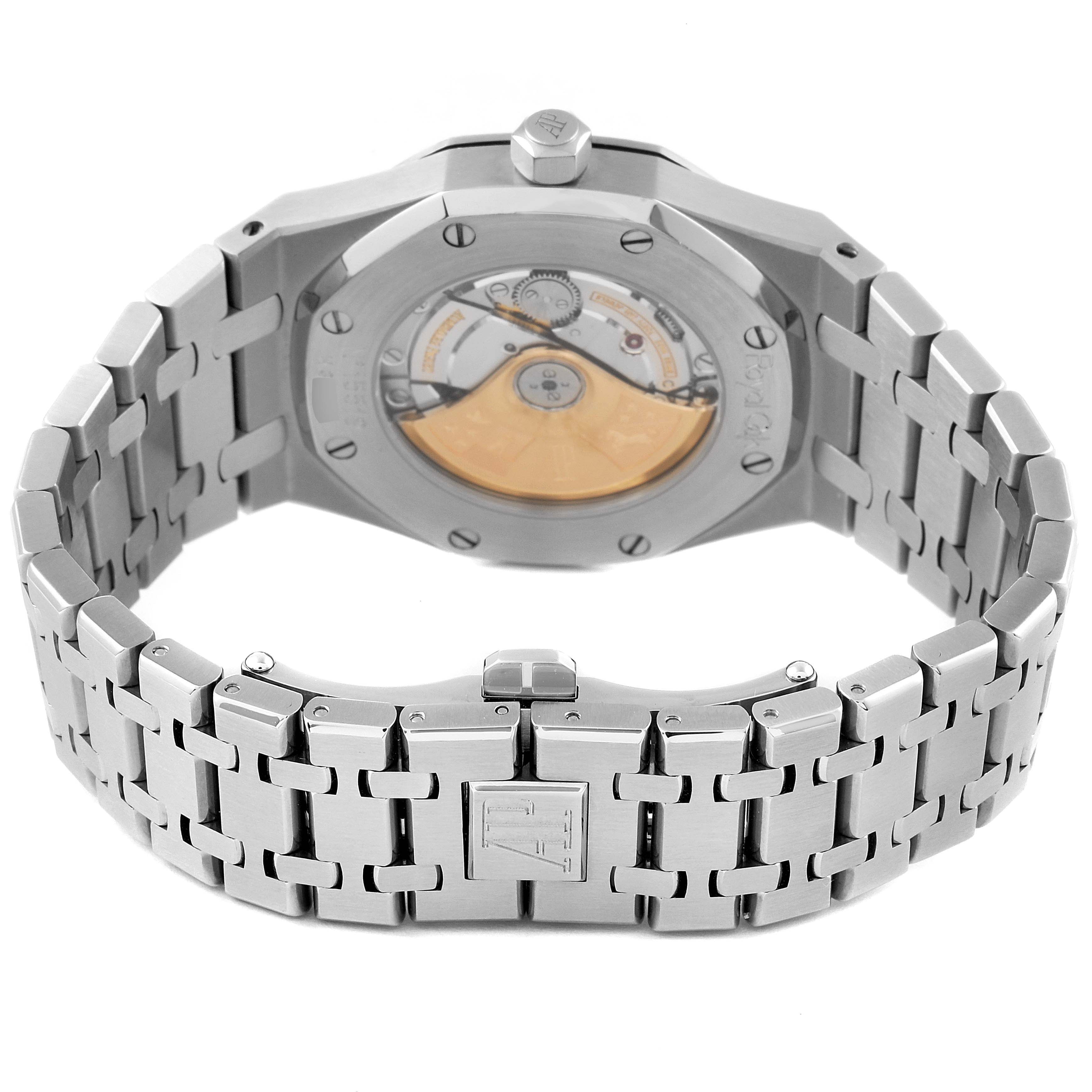 This image shows the back angle of a Royal Oak model by Audemars Piguet, highlighting the caseback and the stainless steel bracelet with clasp.