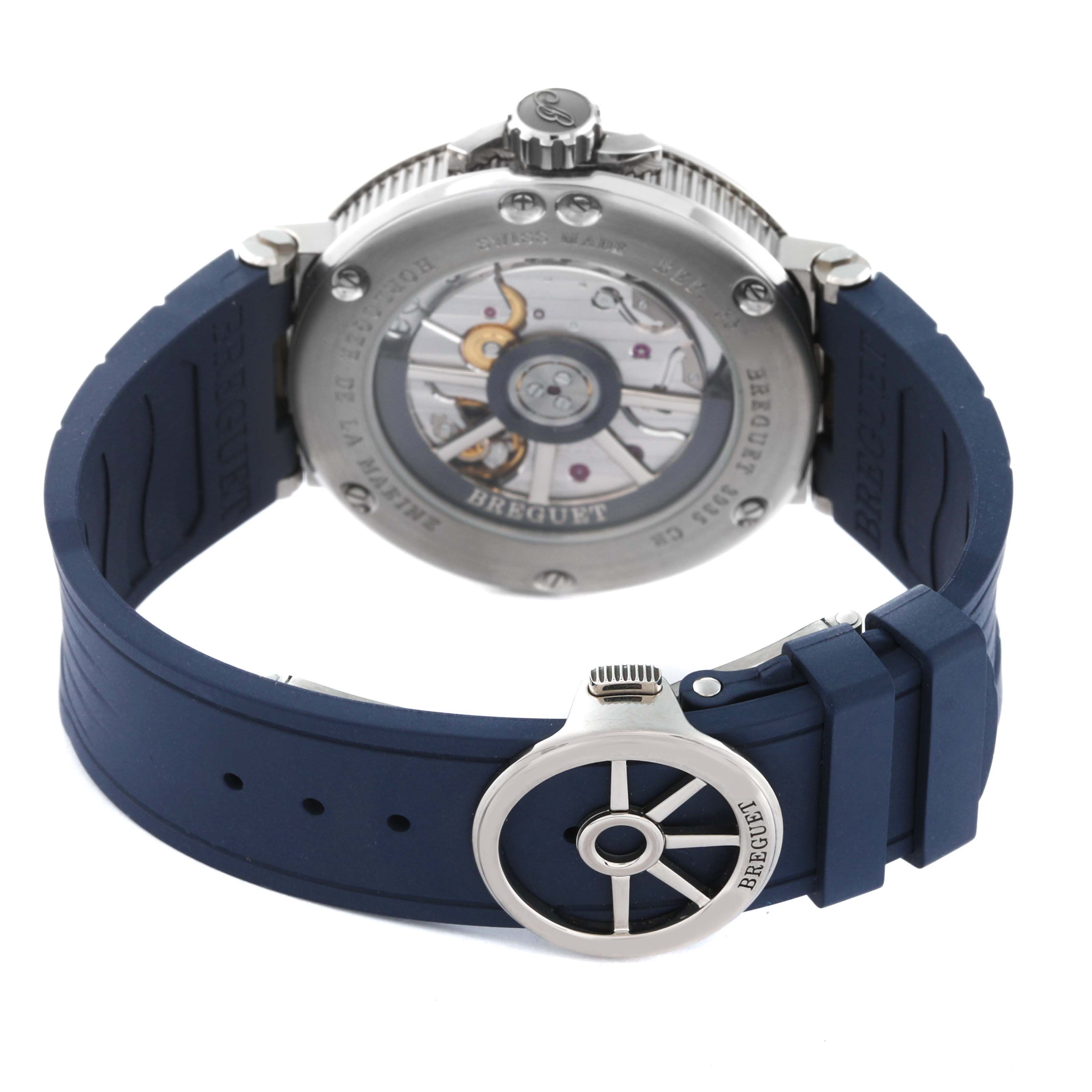 This image shows the back view of the Breguet Marine 5517TI/Y1/5ZU Men's Titanium Blue Dial 5517TI/Y1/5ZU Men's Titanium Blue Dial model watch, highlighting the movement through the transparent case back and the blue rubber strap.