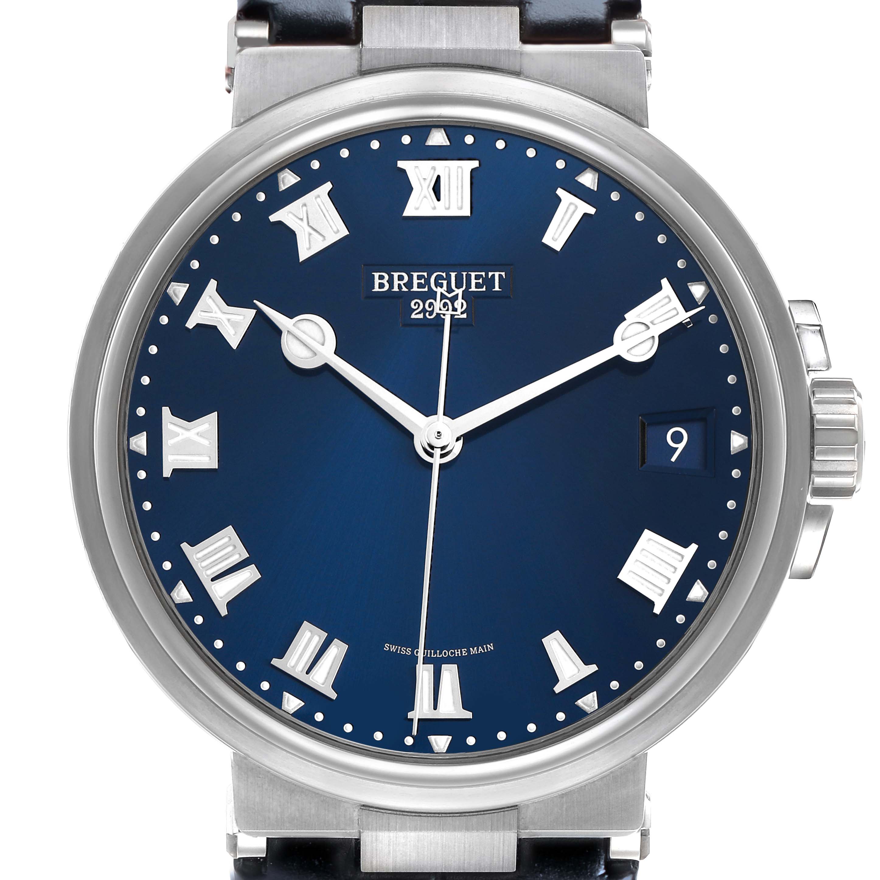 The image shows a frontal view of the Breguet Marine 5517TI/Y1/TZ0 Men's Titanium Blue Dial watch, highlighting the blue dial, Roman numerals, and date window.