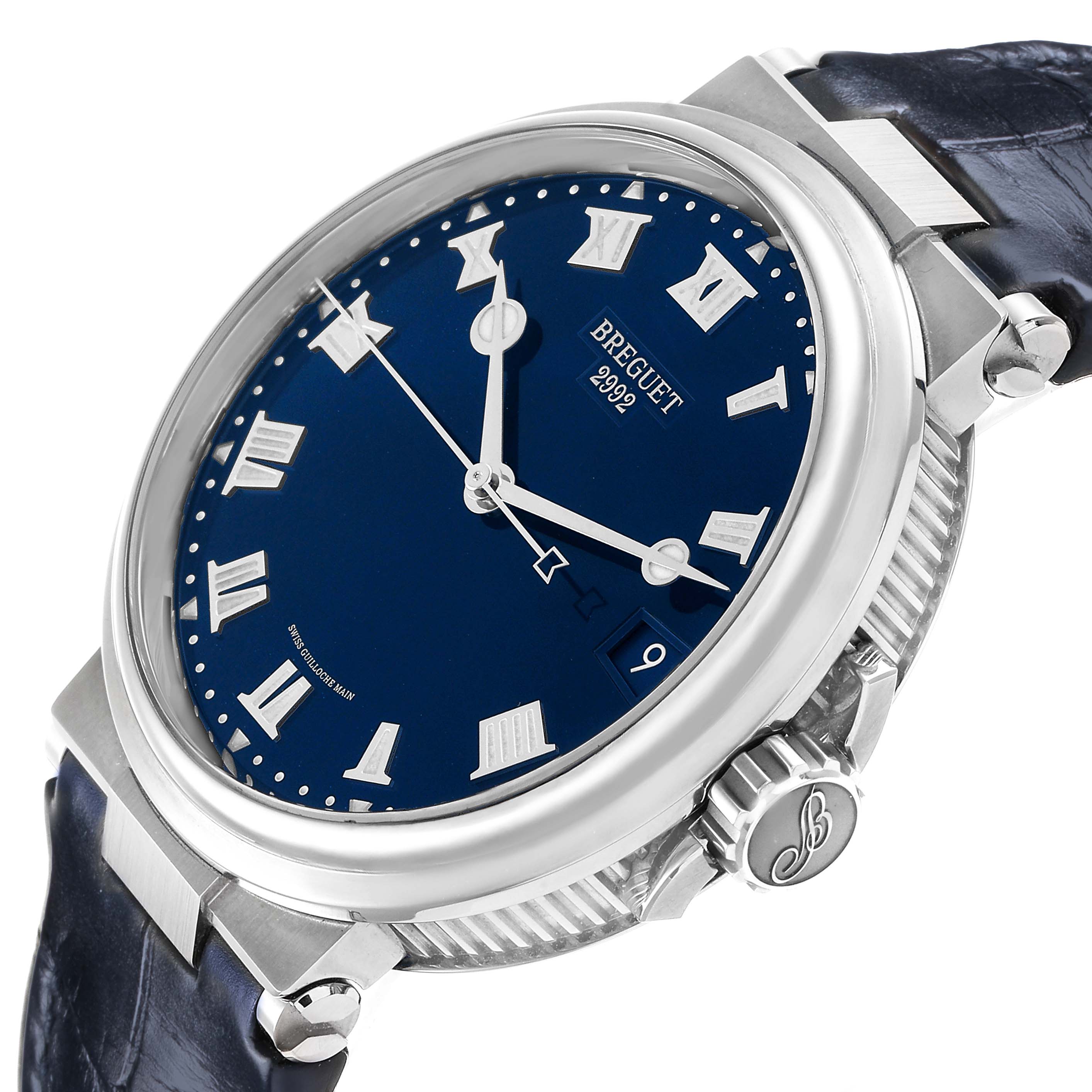The Breguet Marine 5517TI/Y1/TZ0 Men's Titanium Blue Dial watch is shown at a slight angle, highlighting the blue dial, Roman numerals, case, crown, and lugs.