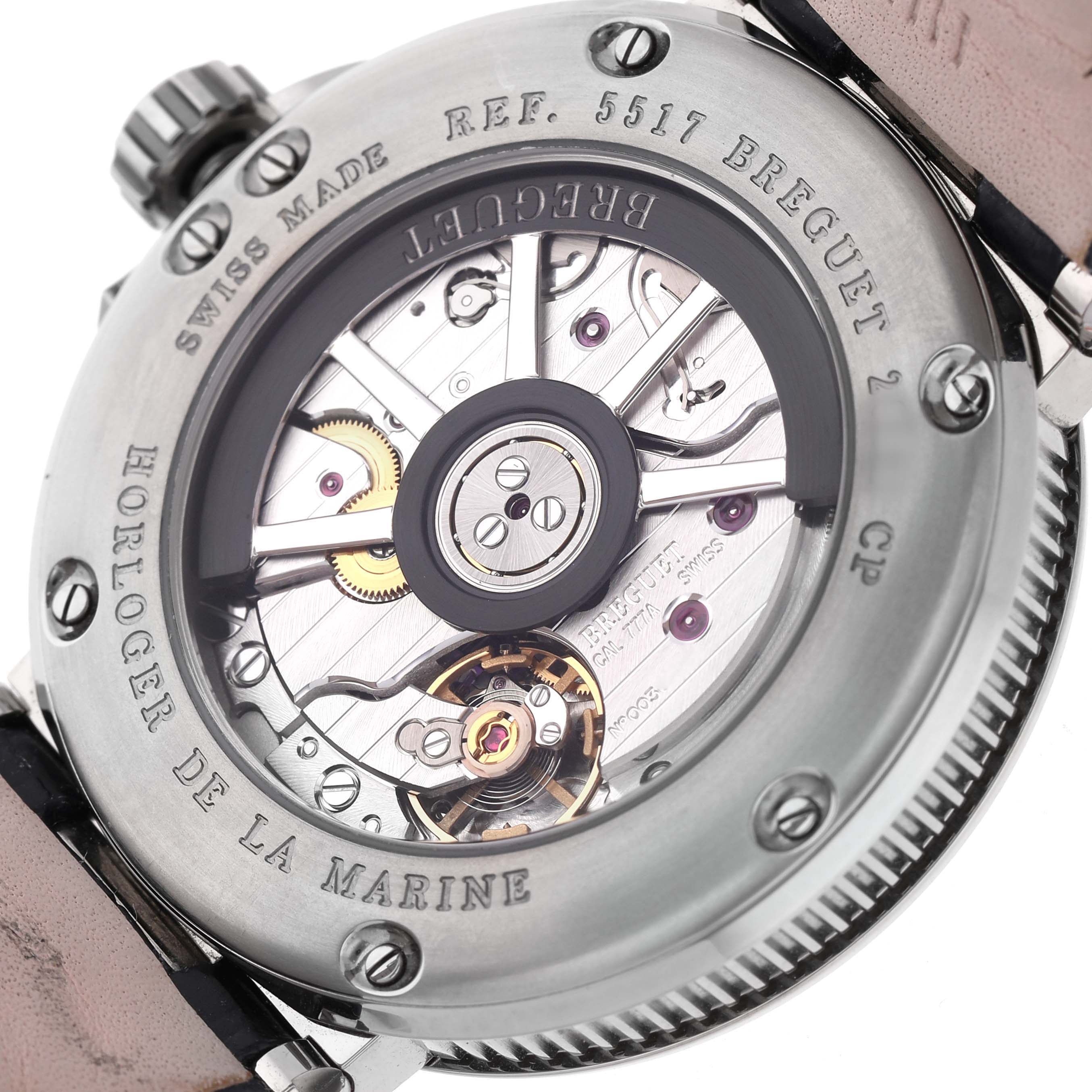 This image shows the back of a Breguet Marine 5517TI/Y1/TZ0 Men's Titanium Blue Dial watch, highlighting the intricate automatic movement and engravings.