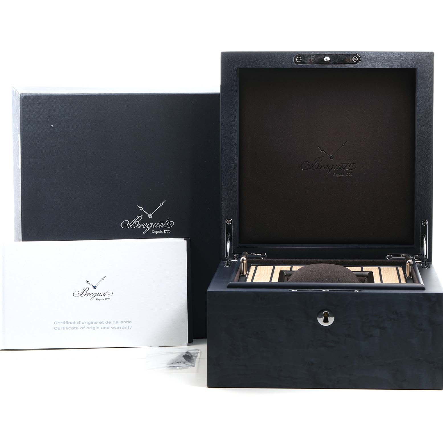 The image shows the Breguet Marine 5517TI/Y1/TZ0 Men's Titanium Blue Dial watch packaging, including an open box, a certificate, and an outer cover.