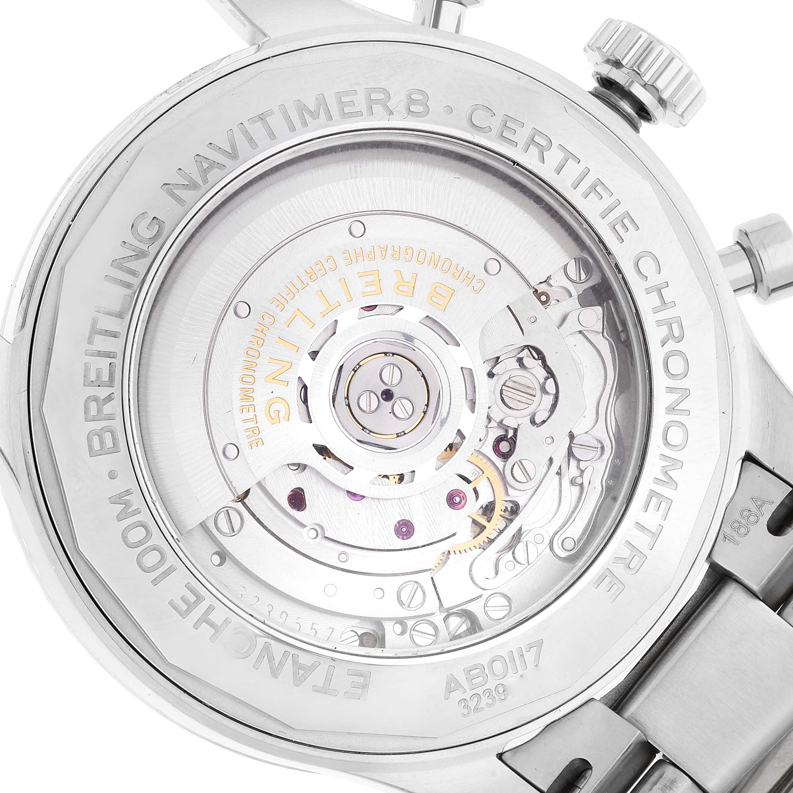 The image shows the back view of the Breitling Navitimer watch, highlighting its movement and engraved details.