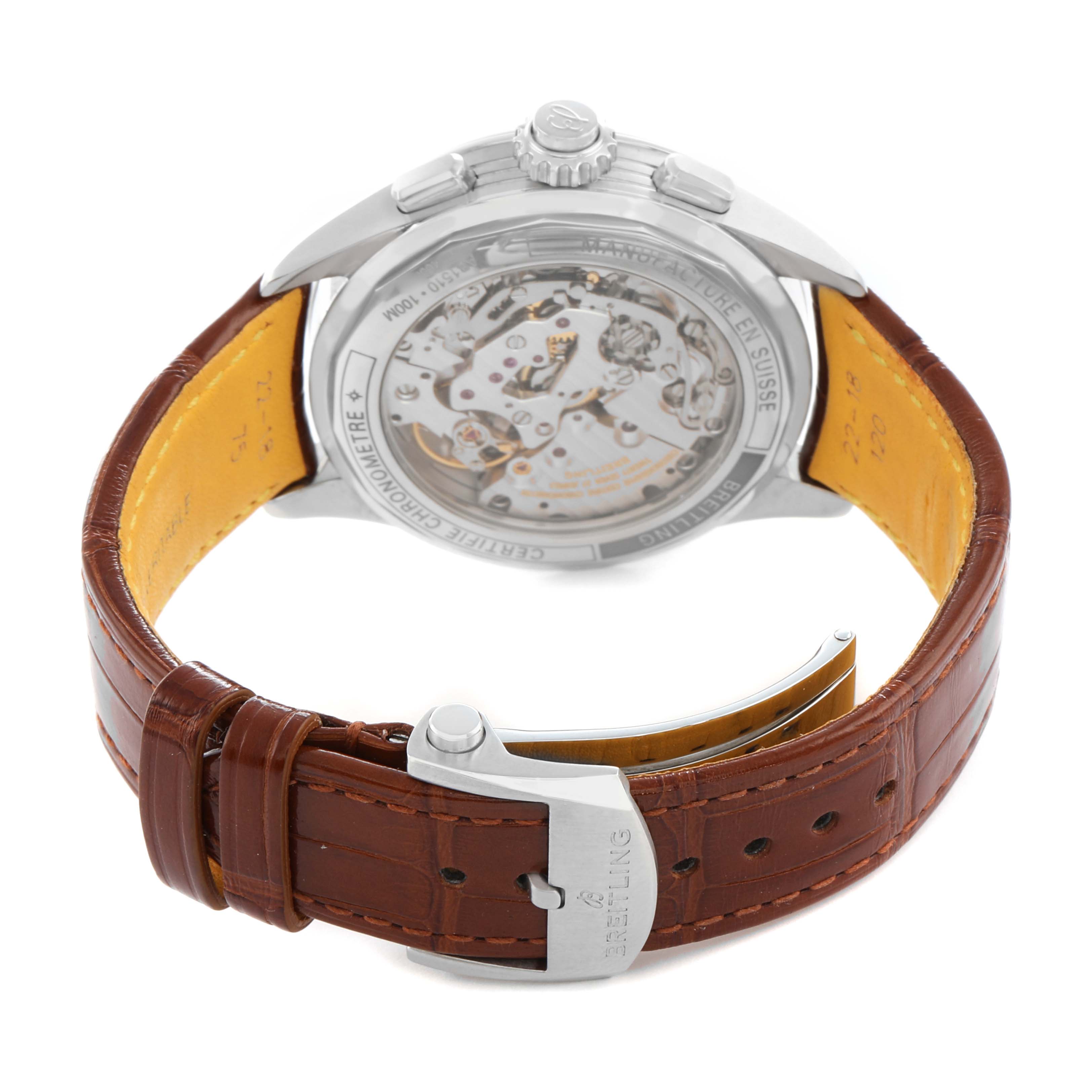 The Breitling Premier AB1510 Men's Stainless Steel Blue Dial watch is shown from the rear, highlighting its transparent case back and brown leather strap.