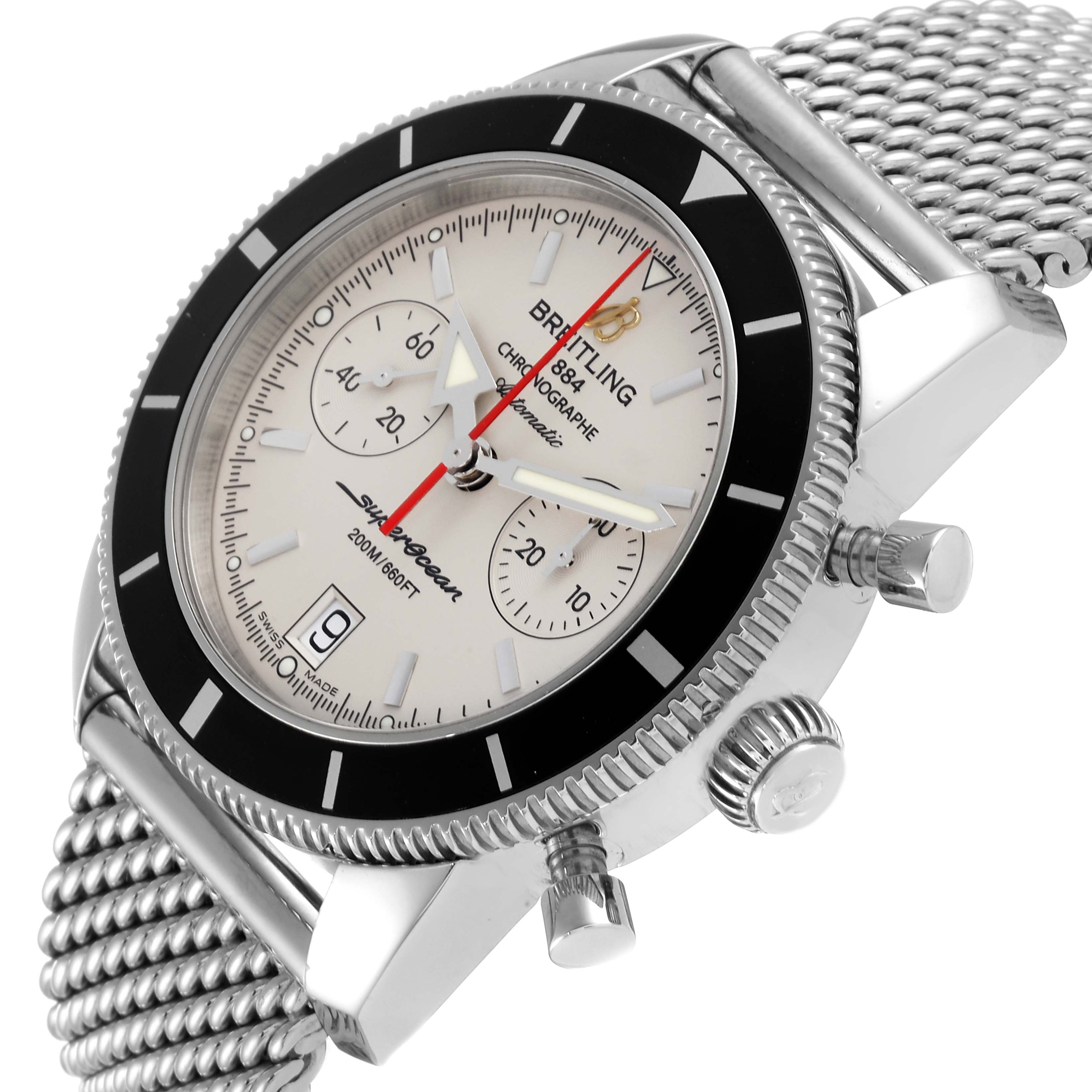 The image shows a Breitling Superocean A23370 Men
s Stainless Steel Silver Dial A23370 Men
s Stainless Steel Silver Dial watch at an angle, highlighting the face, bezel, crown, and pushers, with a mesh bracelet.