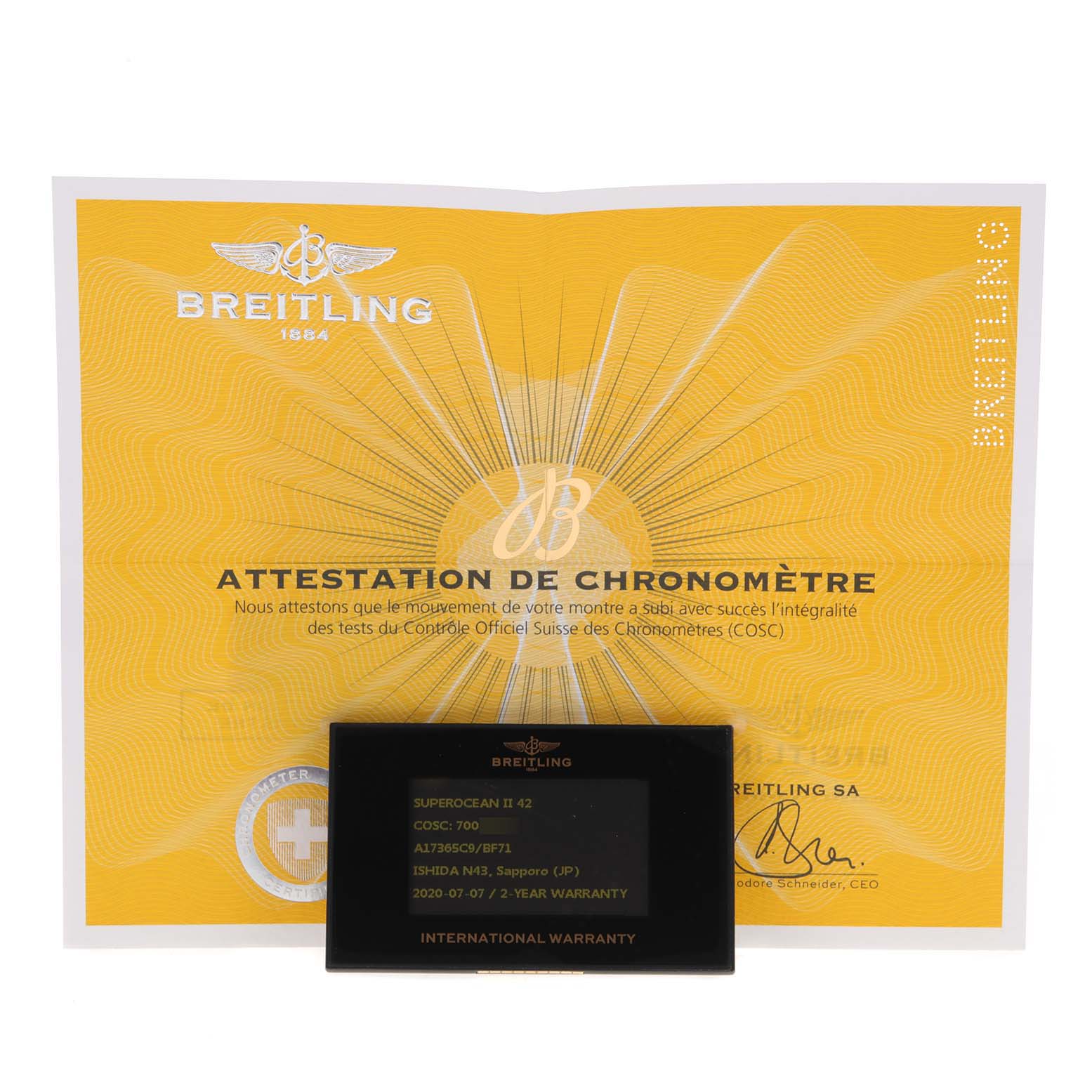 The image shows the warranty card and COSC certification for a Breitling Superocean A17365 Men's Stainless Steel Black Dial A17365 Men's Stainless Steel Black Dial model.