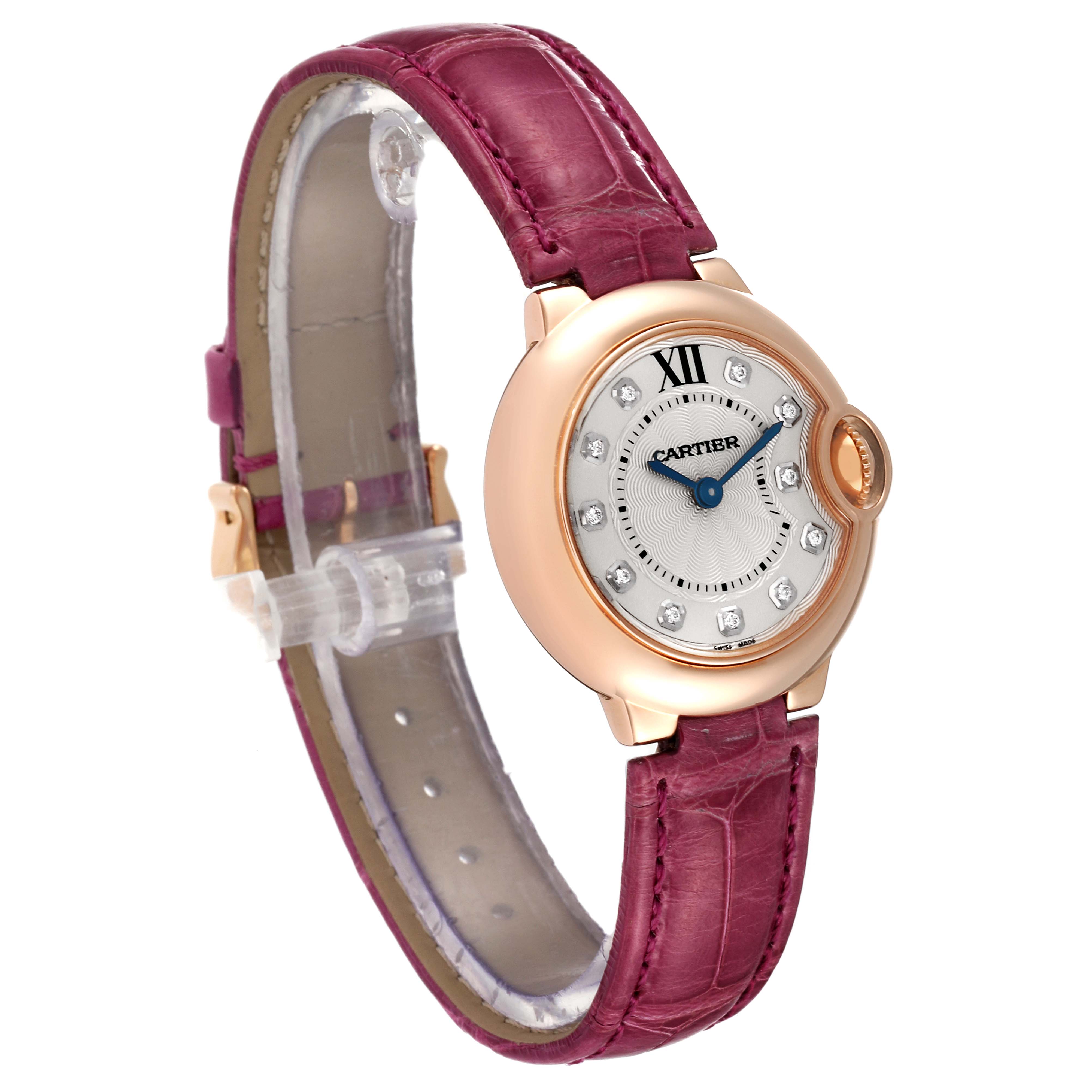 This image shows a Cartier Ballon Bleu WE902050 Women
s Rose Gold Silver Dial WE902050 Women
s Rose Gold Silver Dial watch at a three-quarter angle, highlighting its dial, bezel, and pink leather strap.