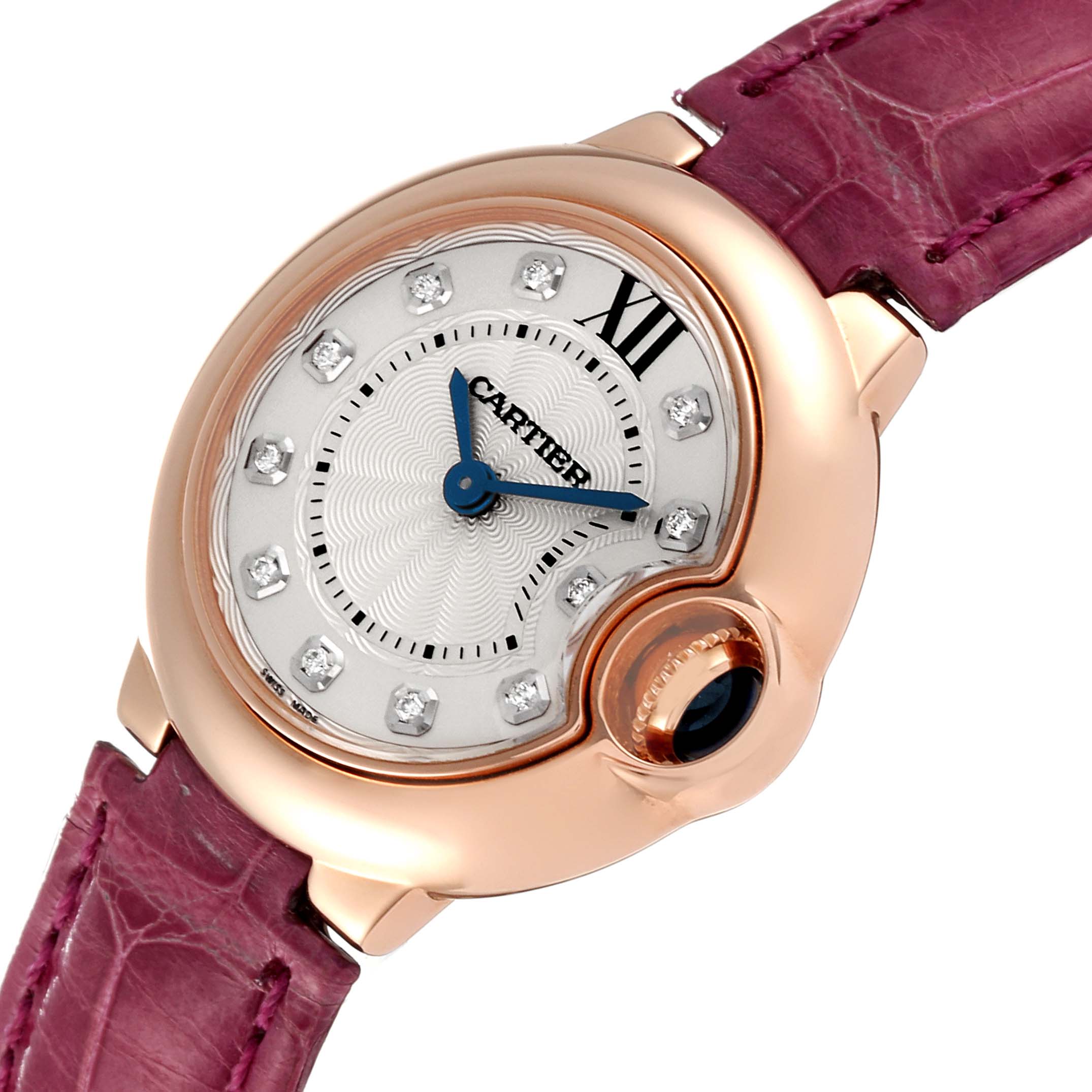 The image shows a Cartier Ballon Bleu WE902050 Women
s Rose Gold Silver Dial WE902050 Women
s Rose Gold Silver Dial watch from an angled close-up, highlighting the face, diamond markers, and purple strap.