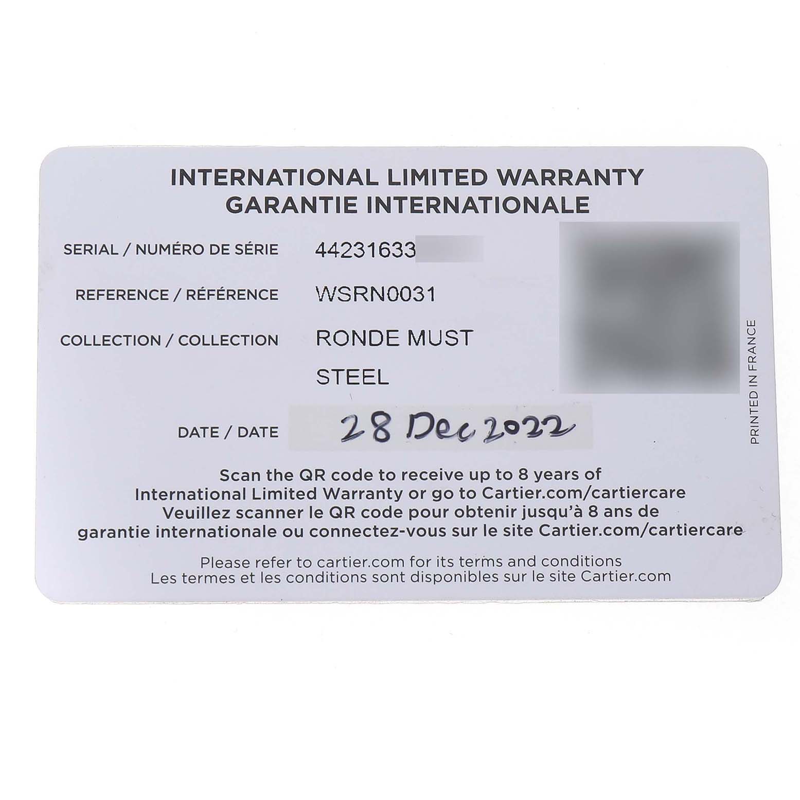 The image shows the international warranty card for the Cartier Ronde WSRN0031 Men's Stainless Steel Silver Dial model, not the watch itself.