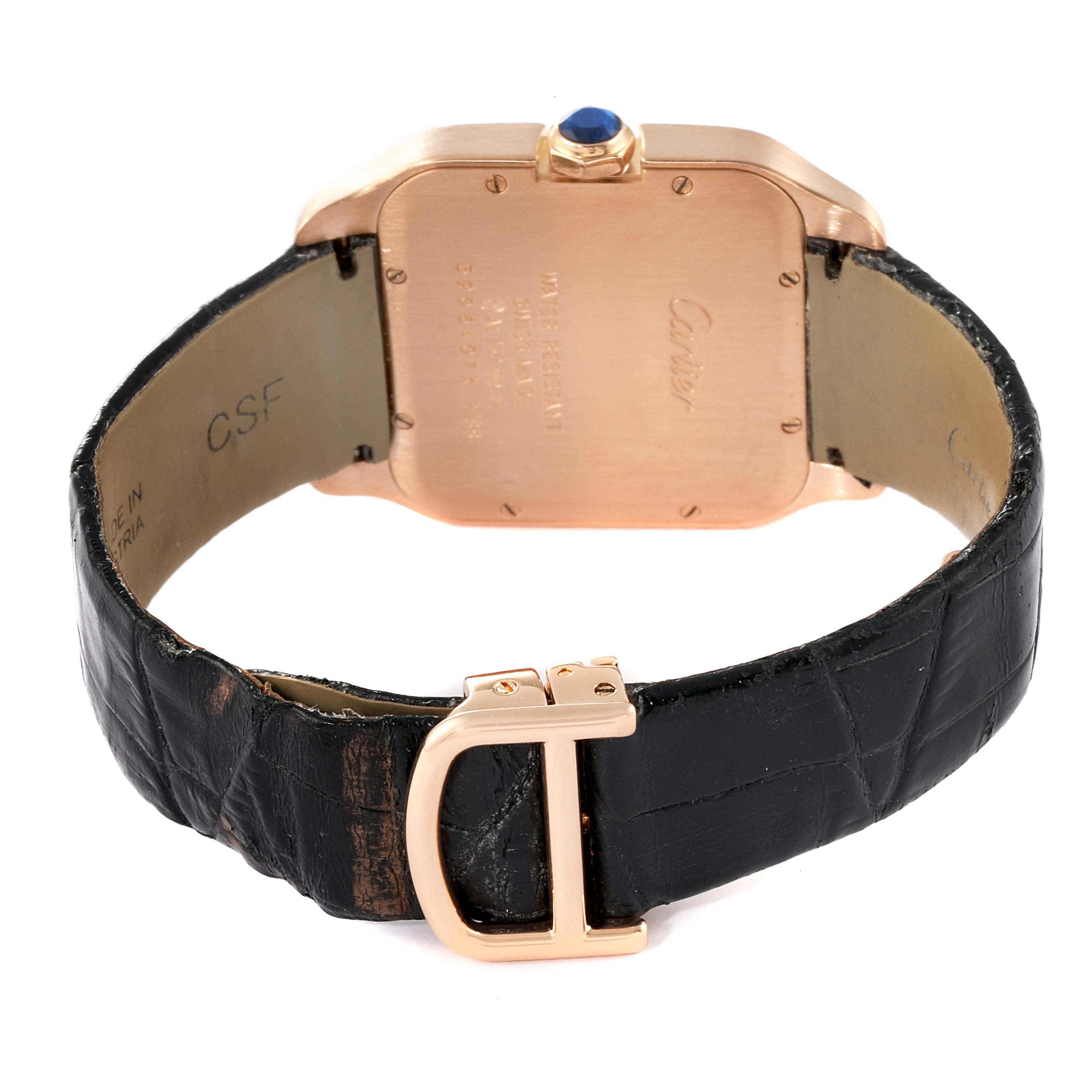 The image shows the backside and black leather strap of a Santos Dumont watch by Cartier.