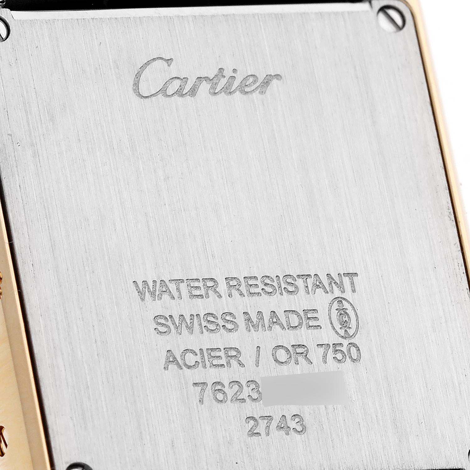 This image shows the back case of the Cartier Tank Solo W1018755 Women's Yellow Gold Silver Dial W1018755 Women's Yellow Gold Silver Dial watch, highlighting its engravings and water-resistant feature.