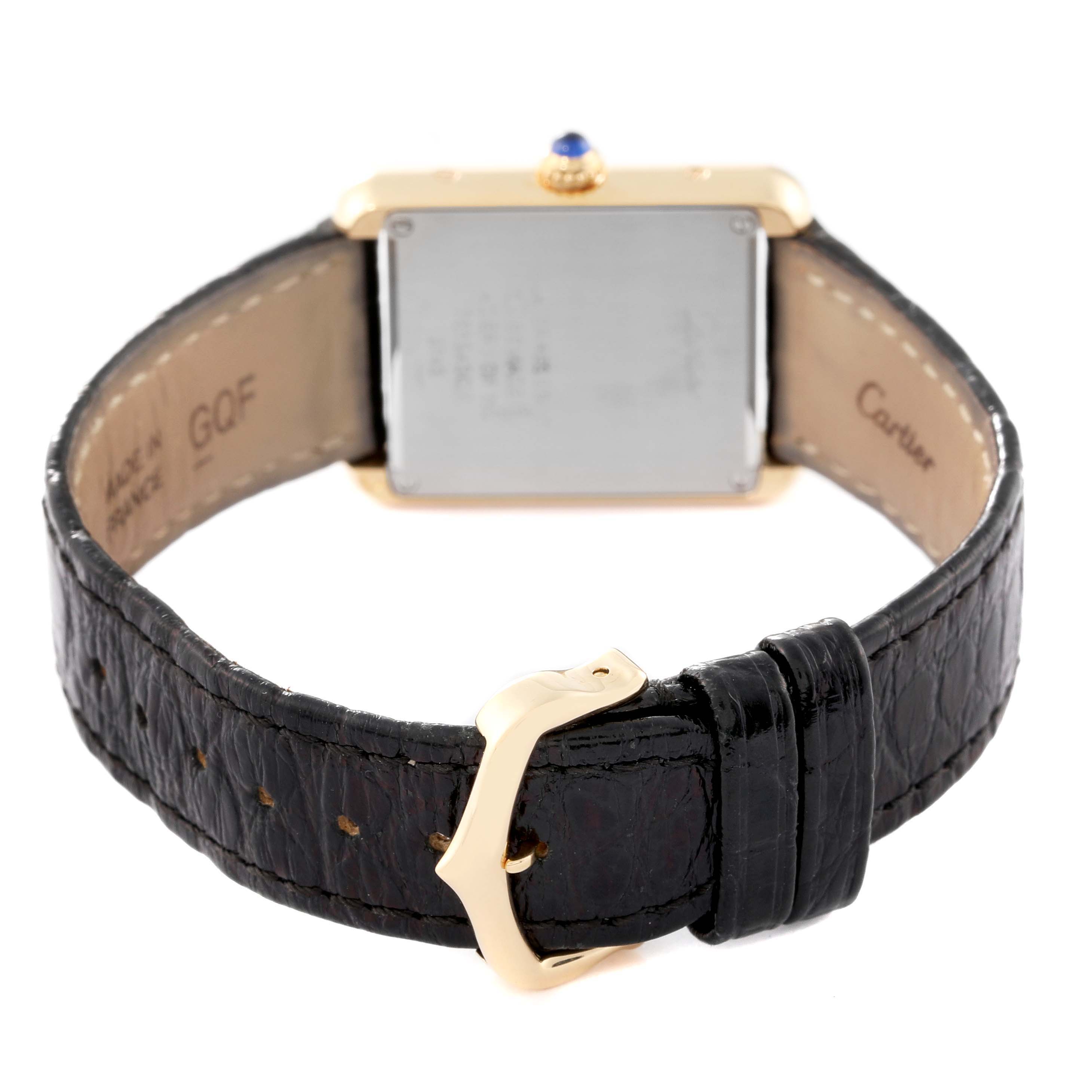 The Cartier Tank Solo W1018755 Women's Steel and Gold (two tone) Silver Dial W1018755 Women's Steel and Gold (two tone) Silver Dial watch is shown from the back, highlighting its leather strap and rectangular case.