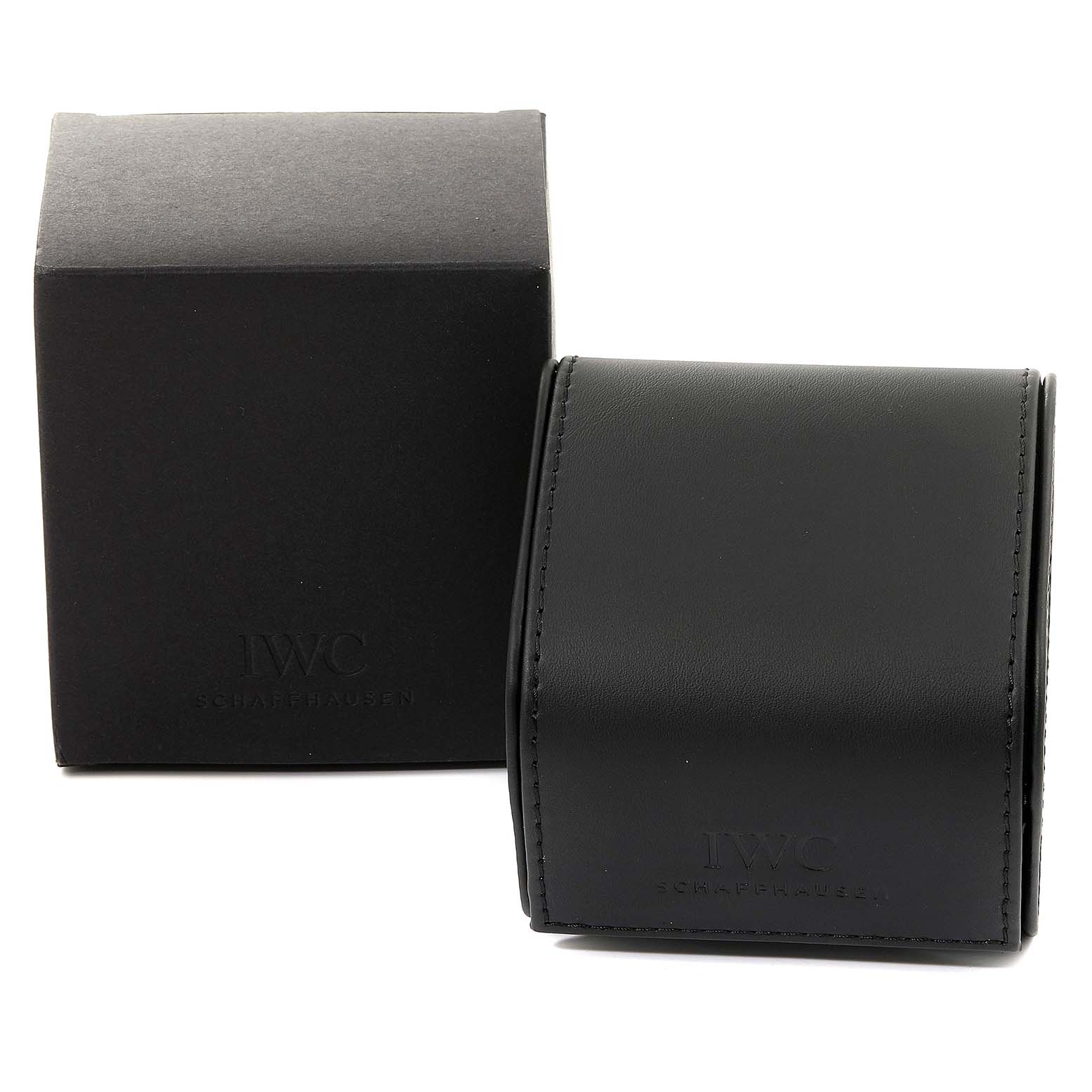 The image shows the packaging box and leather watch case for the IWC Pilot IW325601 Men's Stainless Steel Black Dial IW325601 Men's Stainless Steel Black Dial watch, both in black with branding visible.