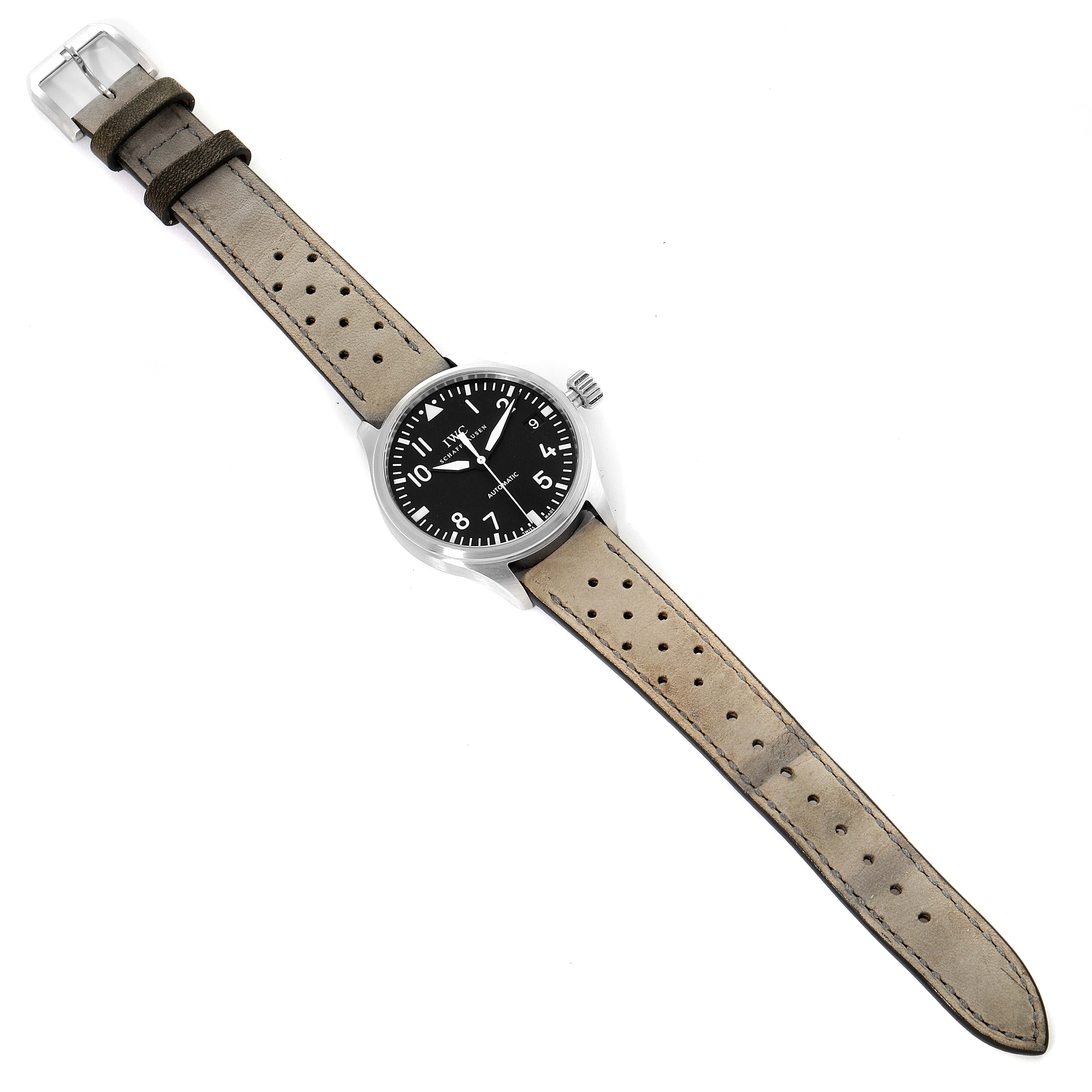 This image displays an IWC Pilot IW325601 Men's Stainless Steel Black Dial IW325601 Men's Stainless Steel Black Dial model watch from a top view, showing its entire strap, dial, and crown.