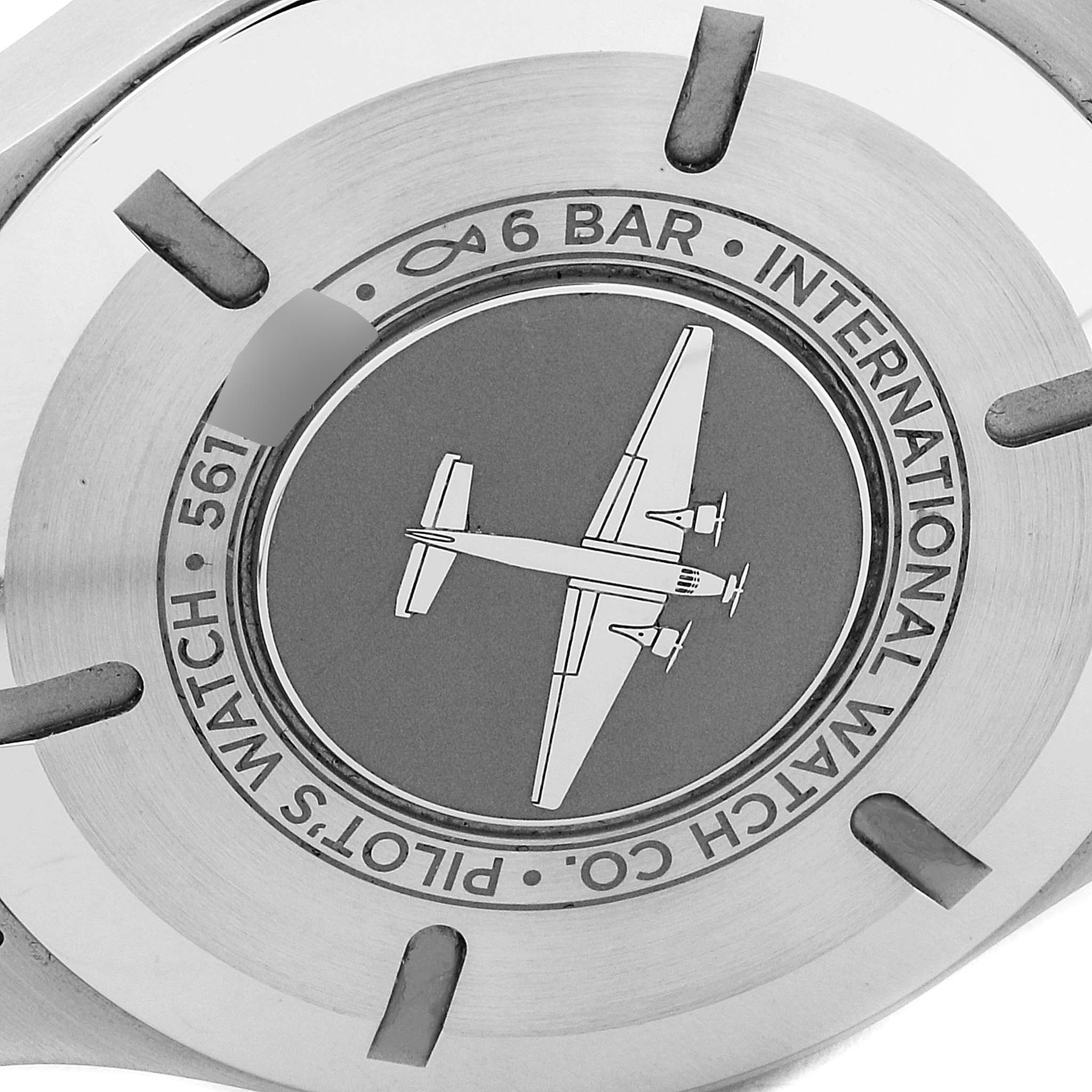 The image shows the case back of an IWC Pilot IW327017 Men's Stainless Steel Silver Dial IW327017 Men's Stainless Steel Silver Dial model watch, featuring airplane engraving and water resistance details.