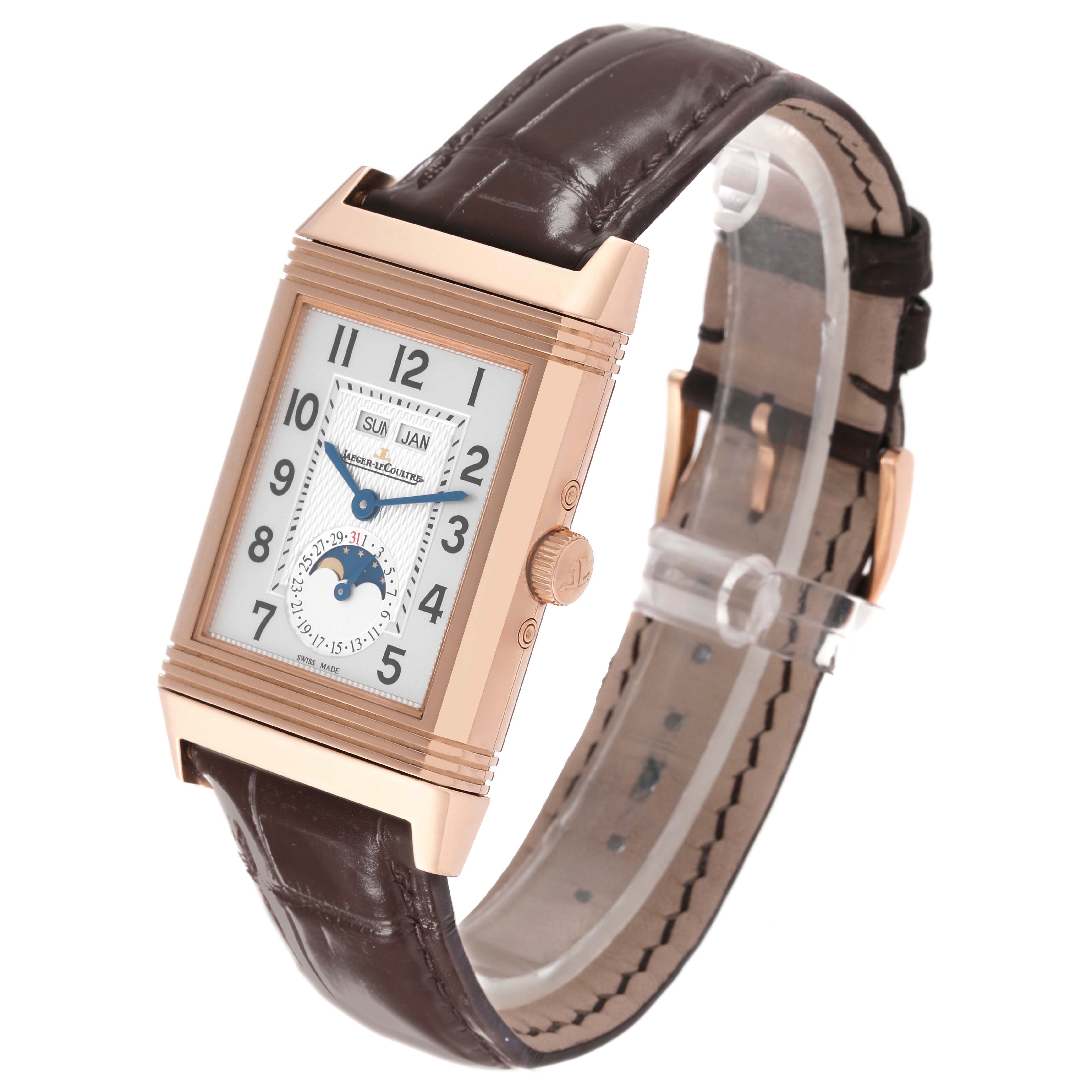 This image shows a Jaeger LeCoultre Reverso Q3752520 Men's Rose Gold Silver Dial Q3752520 Men's Rose Gold Silver Dial watch at a slight angle, displaying its face, crown, and leather strap.
