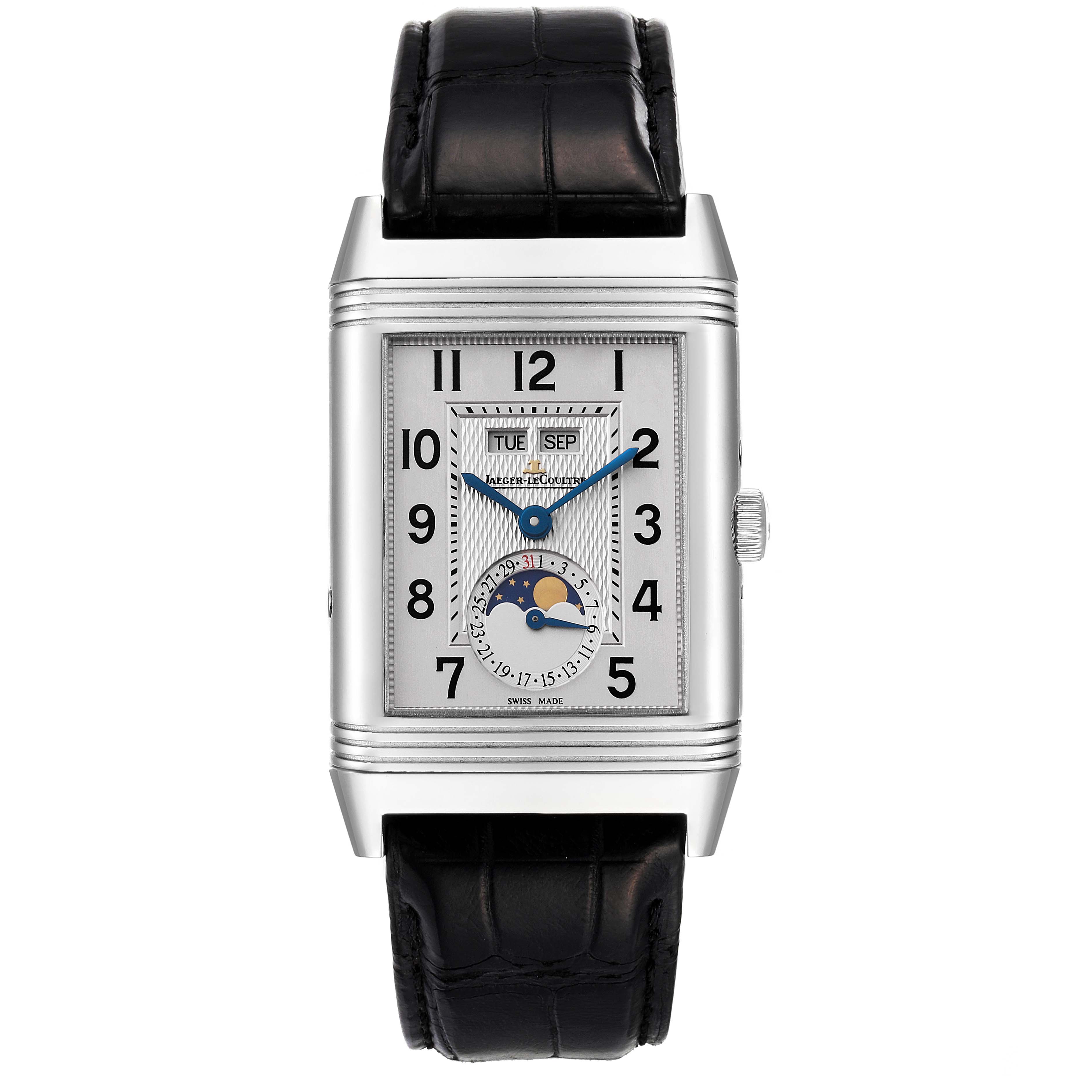 The image shows a front view of a Jaeger-LeCoultre Reverso watch, highlighting its rectangular face, calendar, and moon phase features.