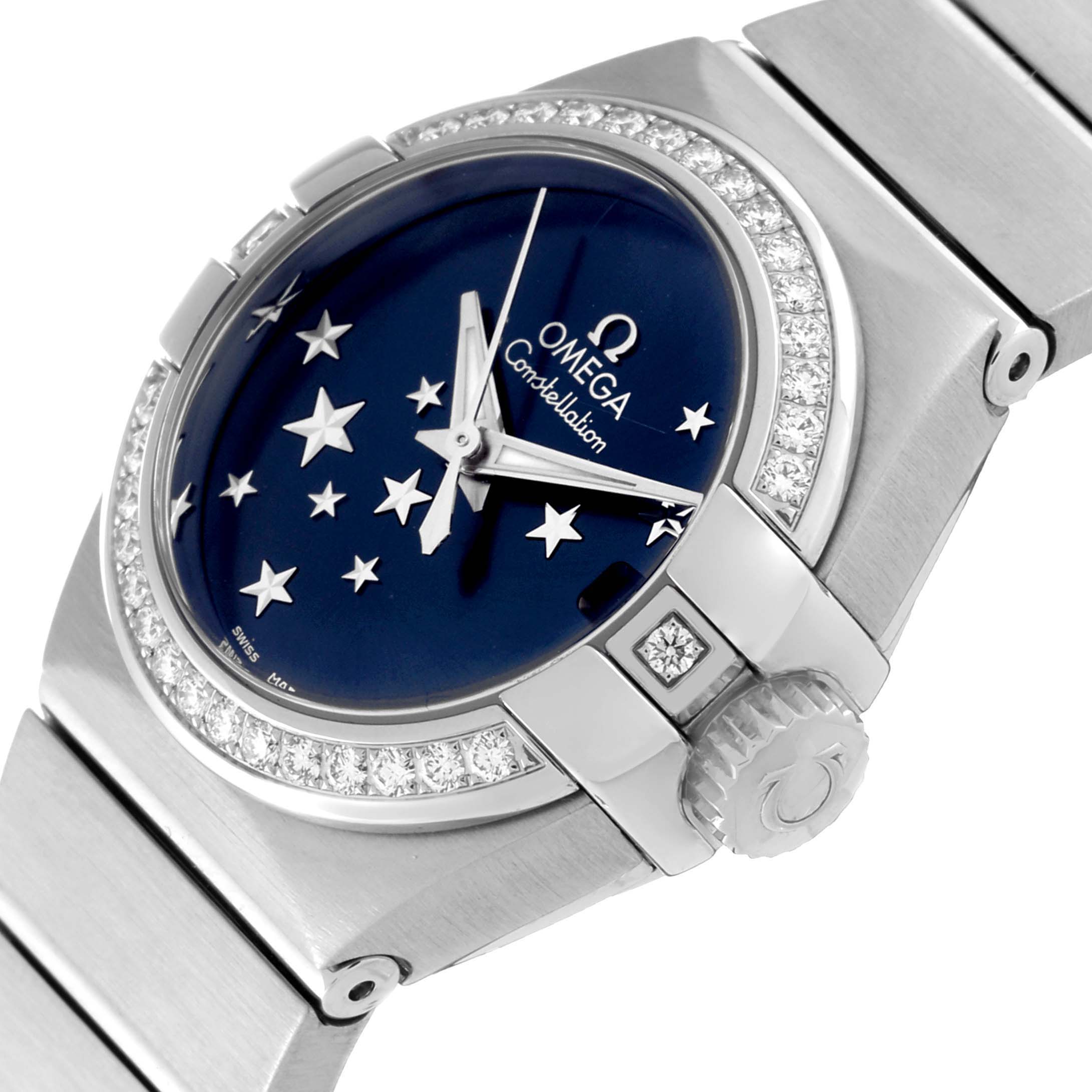 The image shows a close-up side angle of the Omega 123.15.27.20.03.001 Women's Stainless Steel Blue Dial 123.15.27.20.03.001 Women's Stainless Steel Blue Dial Constellation Orbis Star Steel Diamond Ladies Watch 123.15.27.20.03.001 highlighting its dial, bezel, and bracelet.