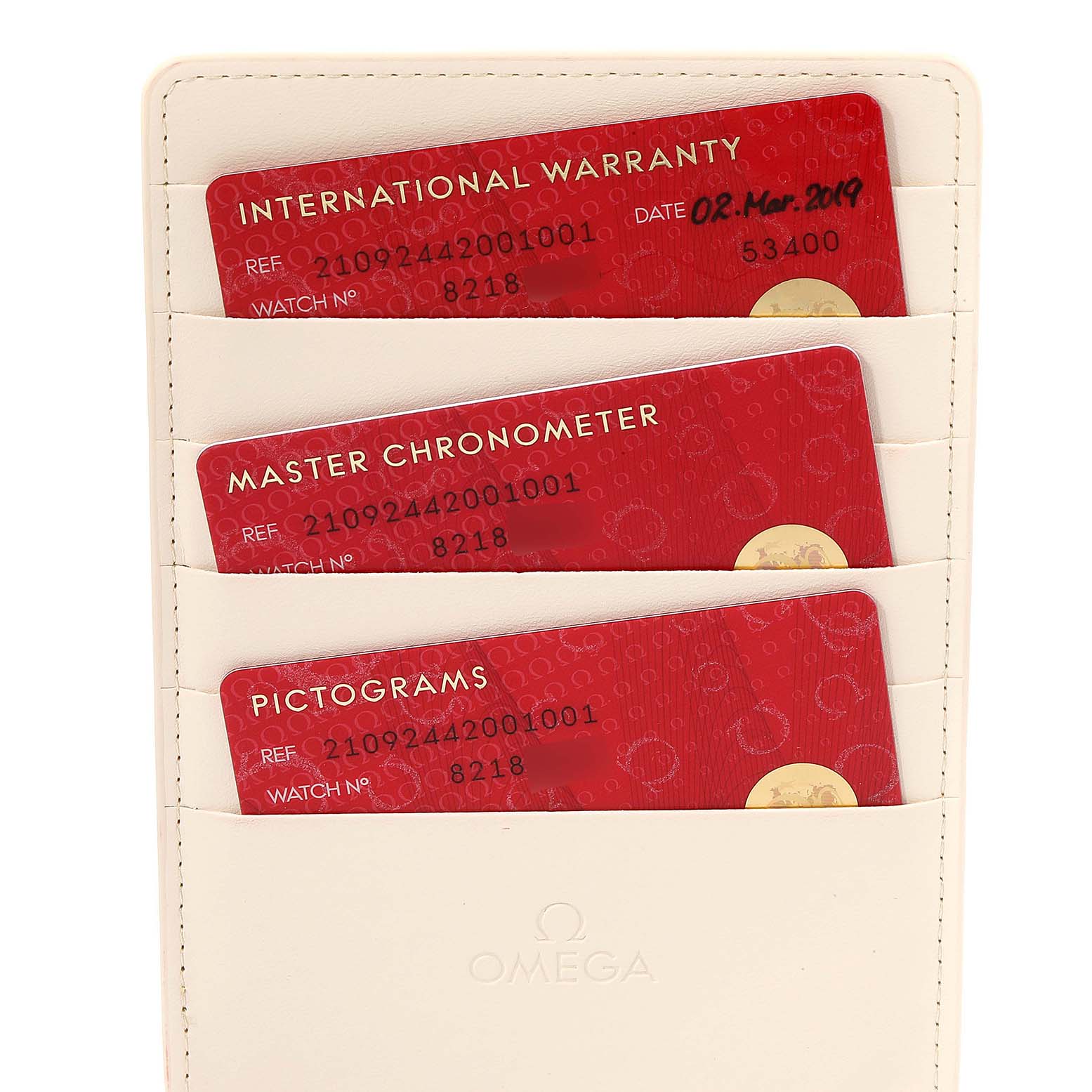 The image shows warranty, chronometer, and pictogram cards in a sleeve for the Omega Seamaster 210.92.44.20.01.001 Men's Ceramic Black Dial 210.92.44.20.01.001 Men's Ceramic Black Dial watch.