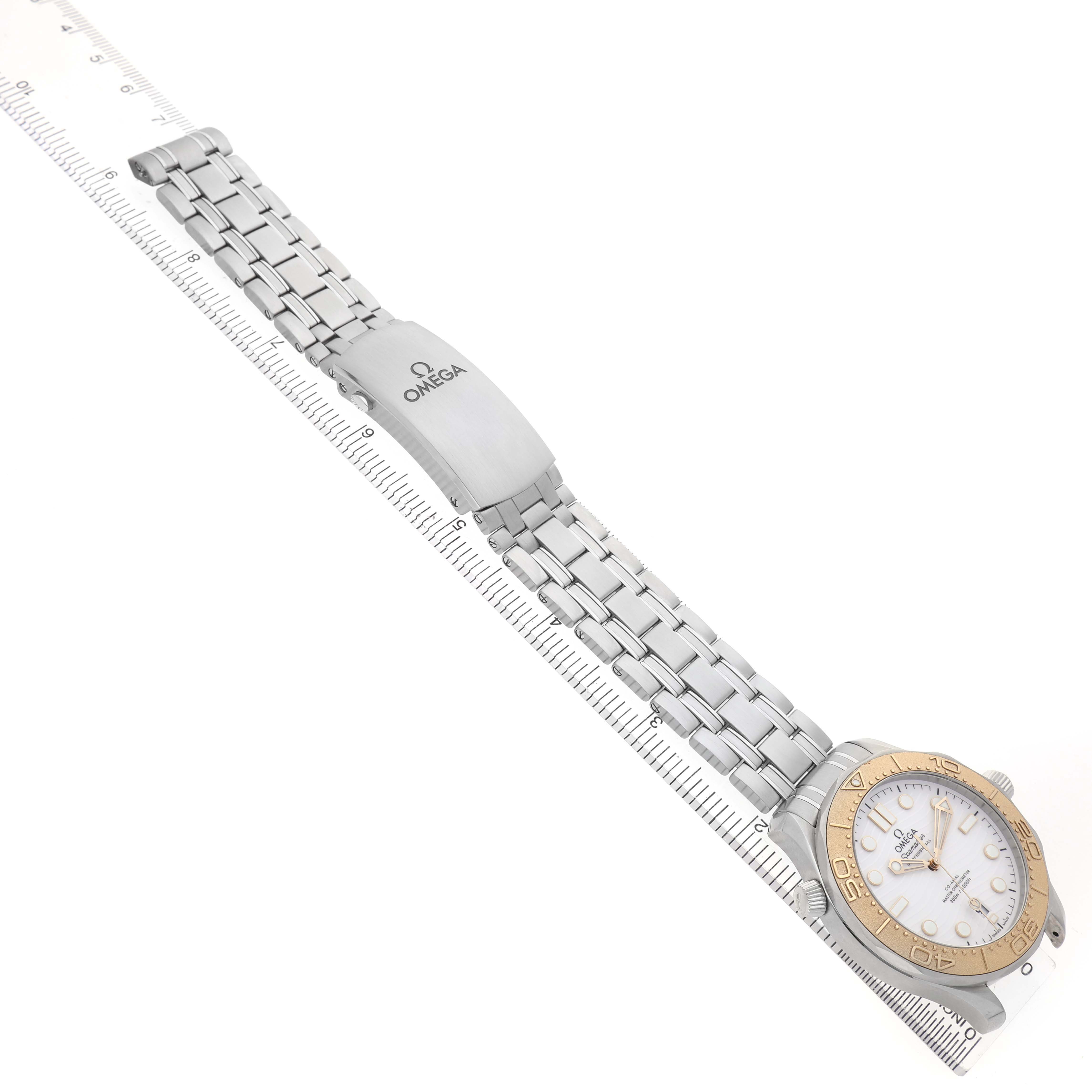 The Omega Seamaster 522.21.42.20.04.001 Men's Stainless Steel White Dial watch is shown from above, highlighting the face, bezel, bracelet, and clasp.