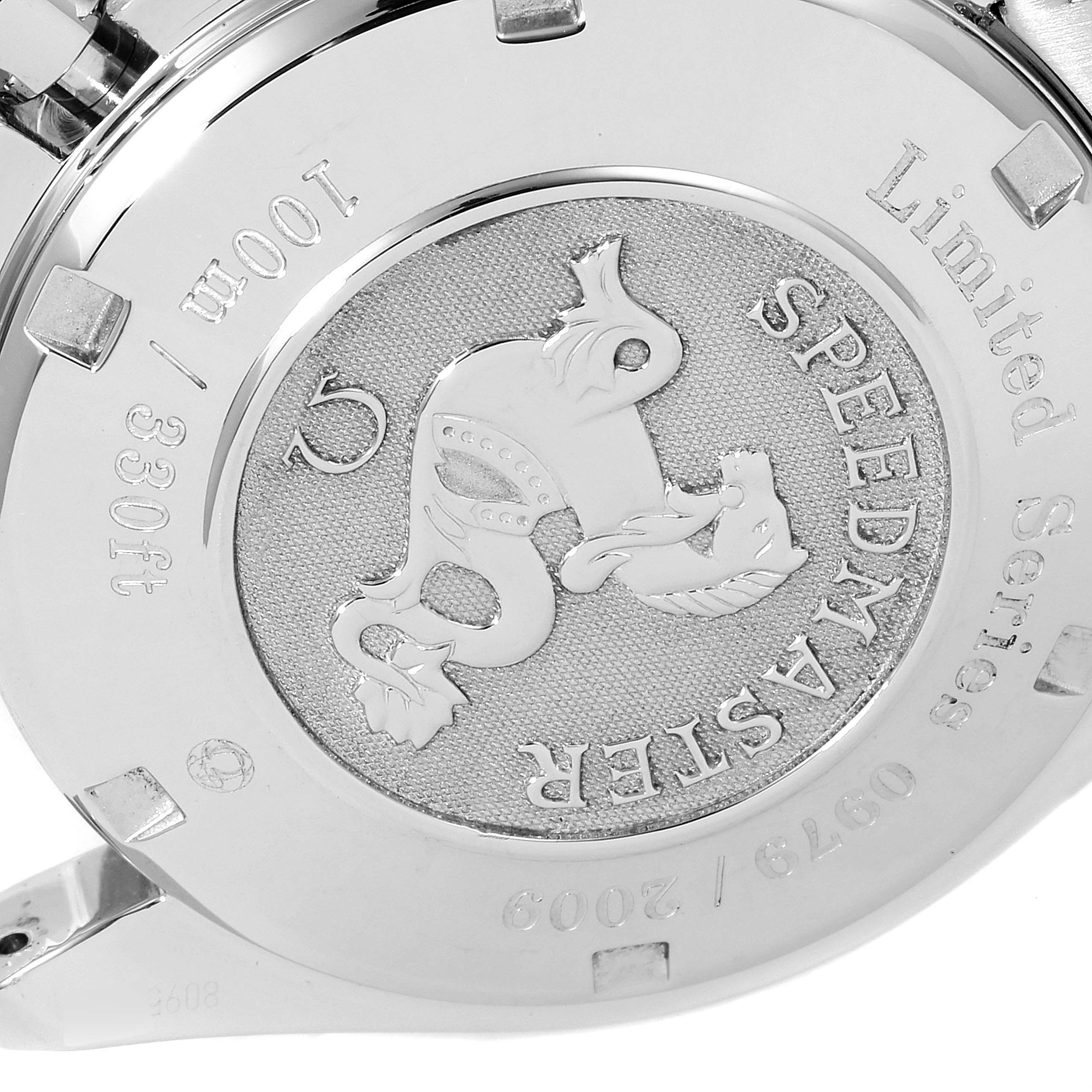 This image shows the case back of the Omega Speedmaster 323.30.40.40.02.001 Men's Stainless Steel White Dial 323.30.40.40.02.001 Men's Stainless Steel White Dial Limited Series watch, displaying engravings and a decorative emblem.