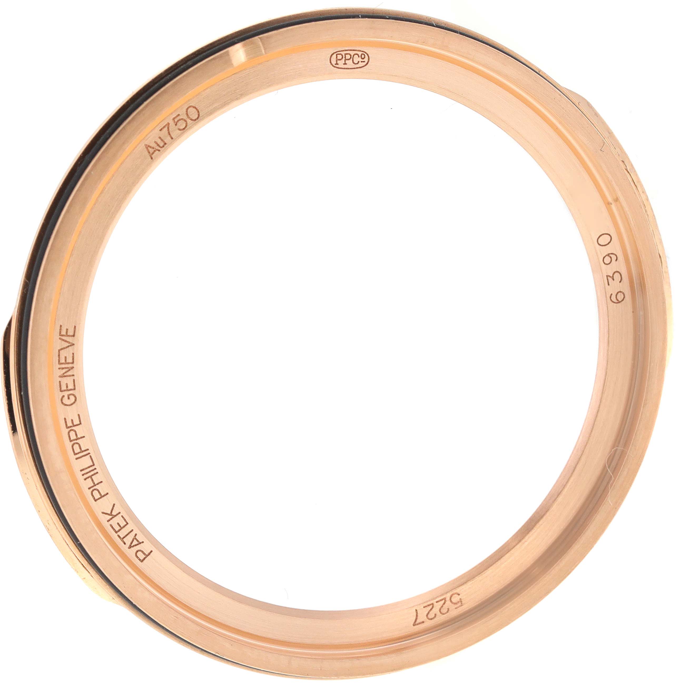 This image shows the bezel of a Patek Philippe Calatrava 5227R-001 Men's Rose Gold Beige Dial 5227R-001 Men's Rose Gold Beige Dial model watch viewed from the side.