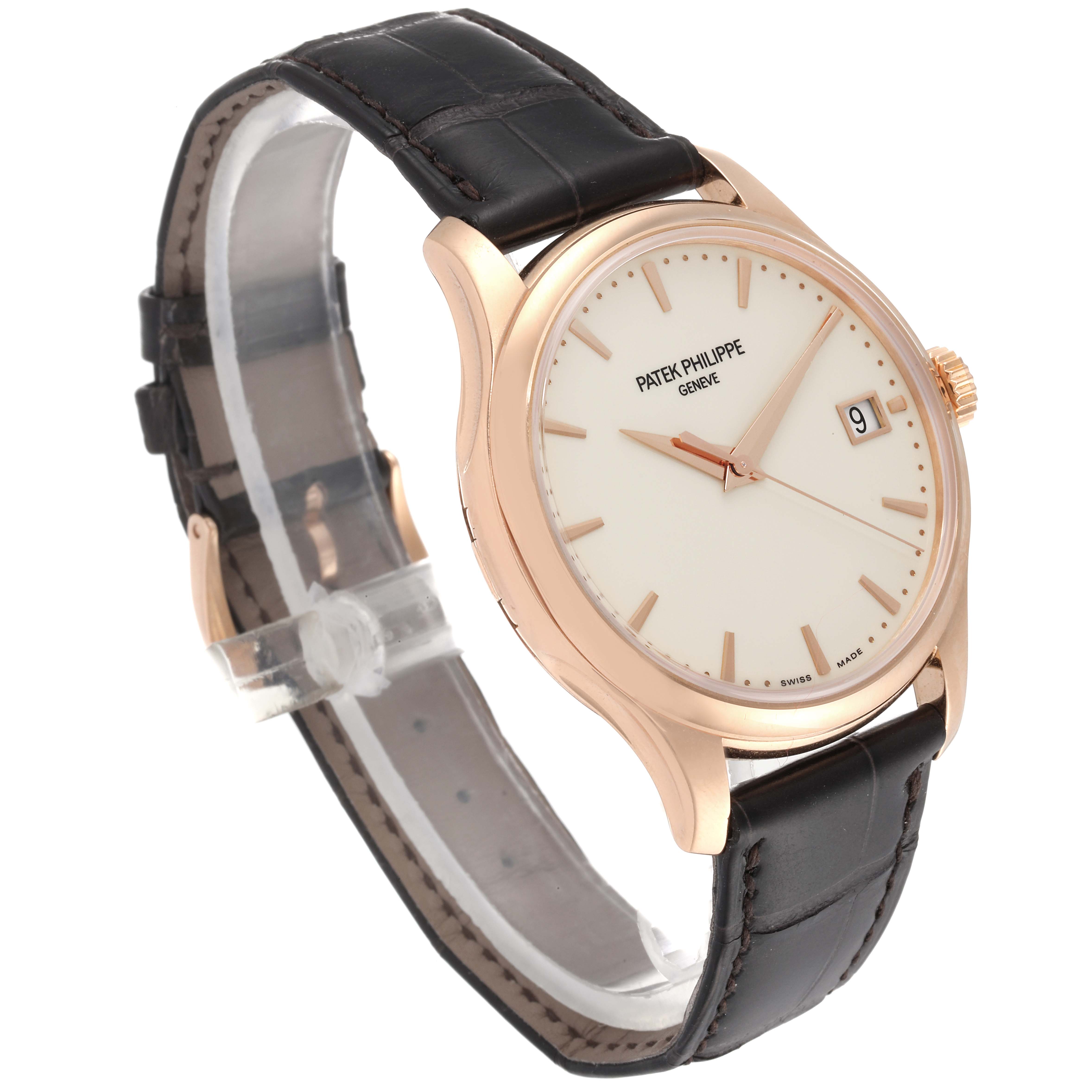 The image shows a Patek Philippe Calatrava 5227R-001 Men's Rose Gold Beige Dial 5227R-001 Men's Rose Gold Beige Dial watch angled from the left side, displaying its face, straps, and case.