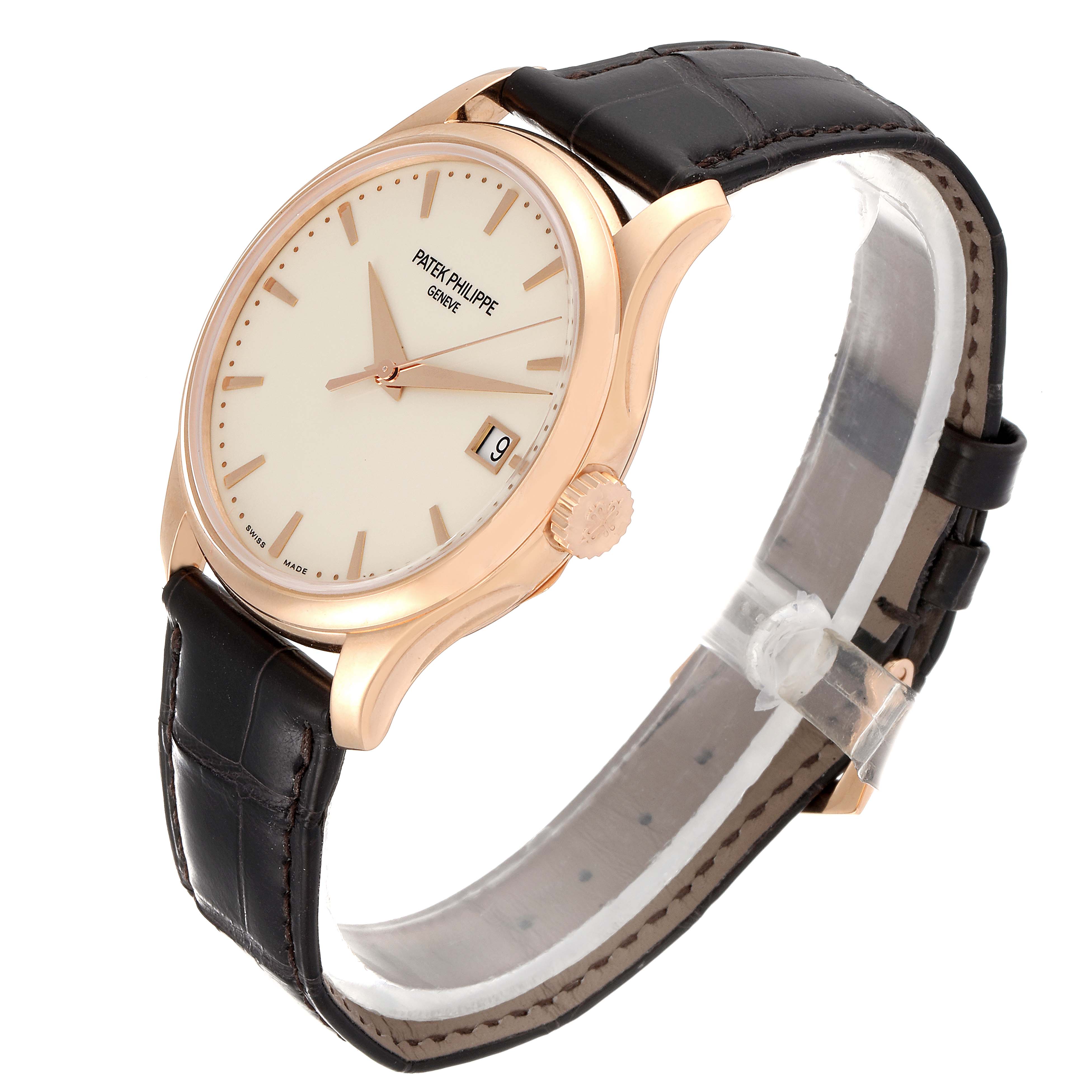 This image shows a side-angle view of a Calatrava model by Patek Philippe, highlighting its face, crown, and leather strap.