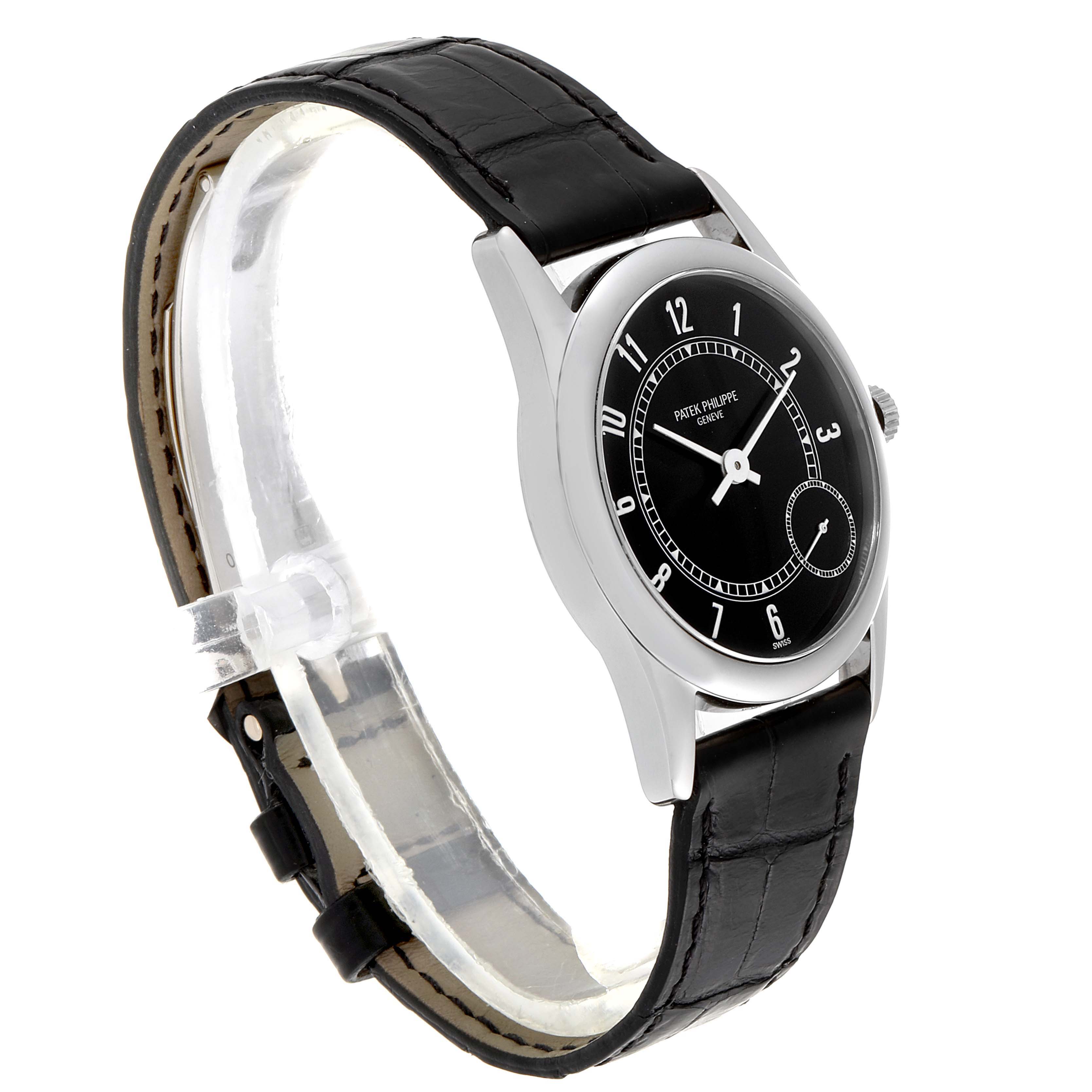 The image shows a side view of a Patek Philippe Calatrava 5000G Men's White Gold Black Dial 5000G Men's White Gold Black Dial watch, highlighting its black dial, case, and leather strap.