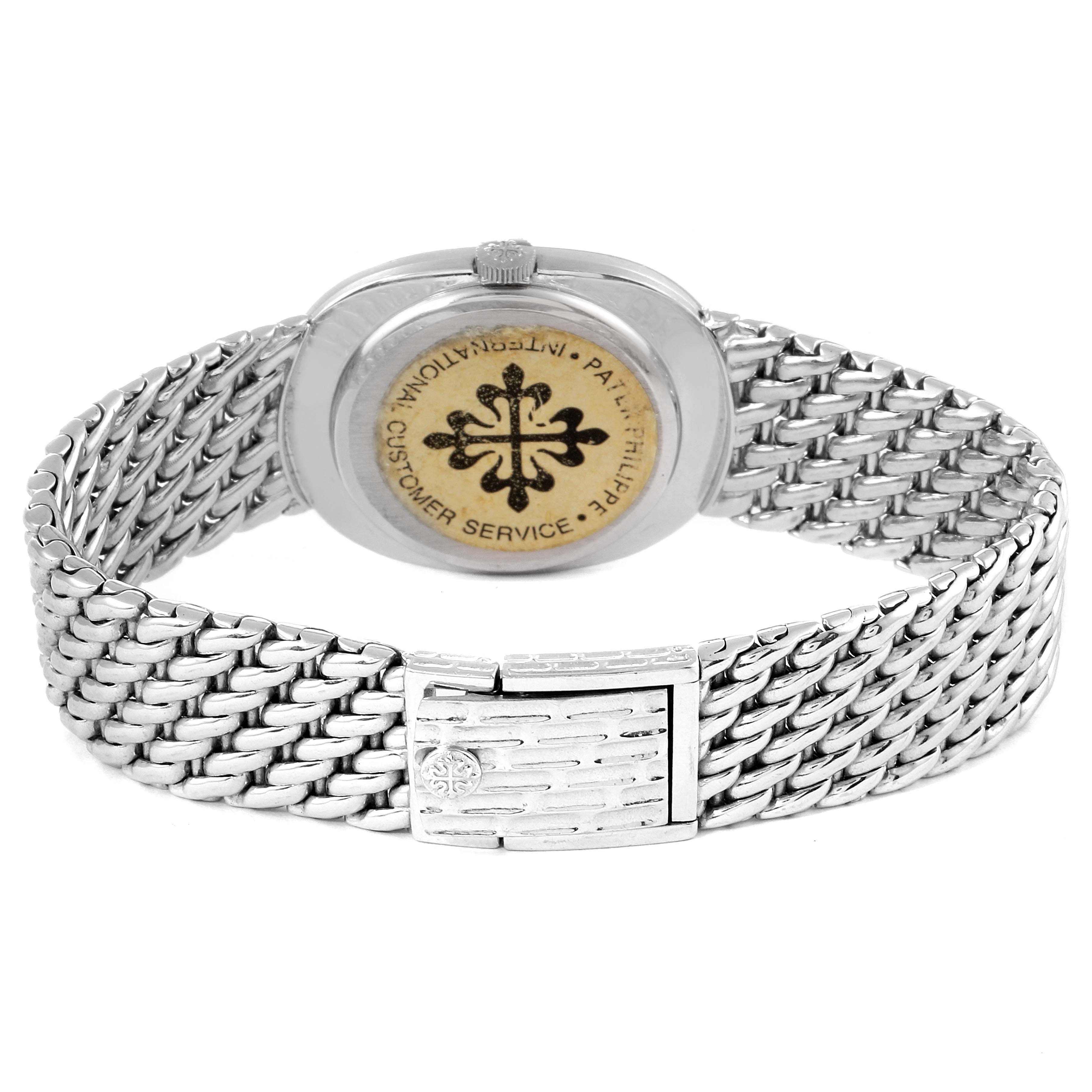 The image shows the back view of the Patek Philippe Golden Ellipse 3848 Men's White Gold Silver Dial 3848 Men's White Gold Silver Dial watch, highlighting its back case and metal bracelet.