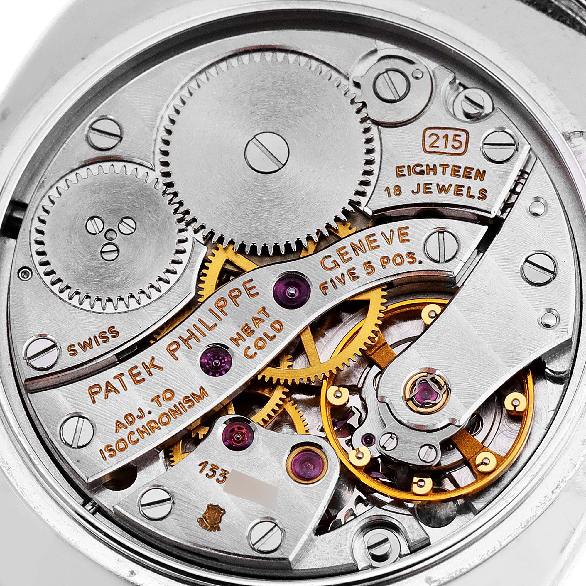 The image shows the intricate internal movement and gears of a Patek Philippe Golden Ellipse 3848 Men's White Gold Silver Dial 3848 Men's White Gold Silver Dial watch from a close-up angle.