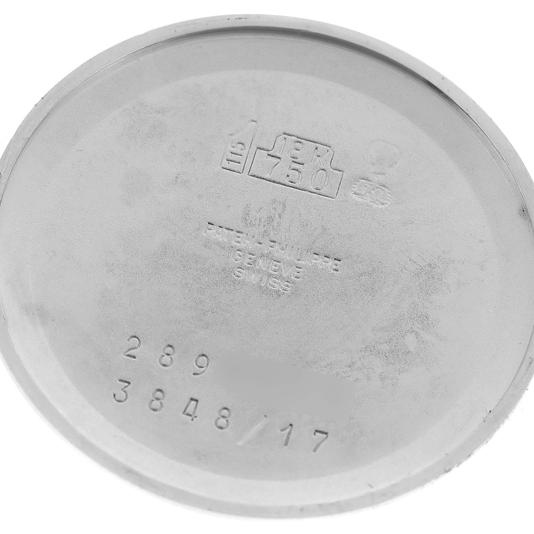 The image shows the backside of the case of a Patek Philippe Golden Ellipse 3848 Men's White Gold Silver Dial 3848 Men's White Gold Silver Dial model watch.