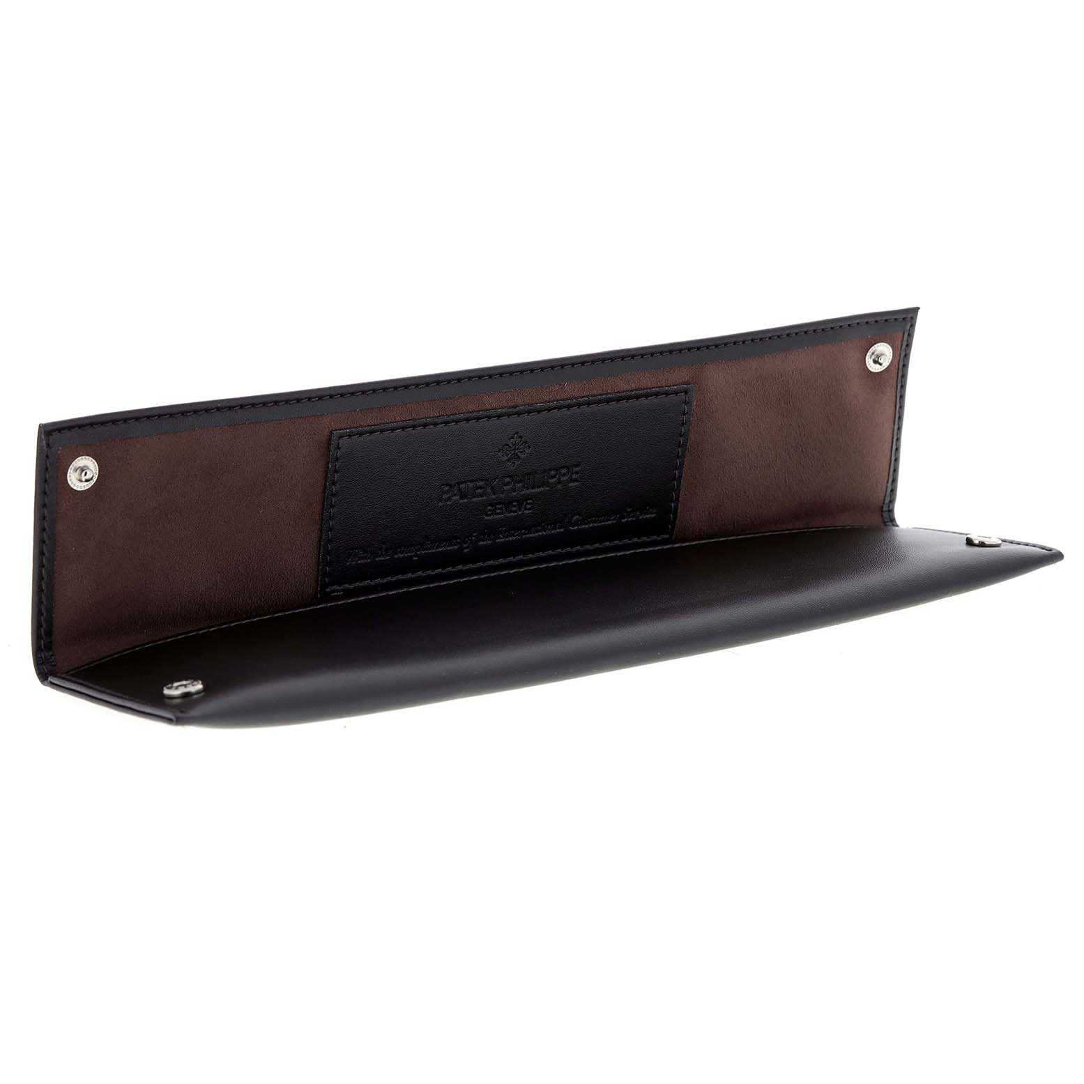 This image shows an open case, likely for a Patek Philippe Golden Ellipse 3848 Men's White Gold Silver Dial 3848 Men's White Gold Silver Dial watch, displaying its inner lining and brand embossment.