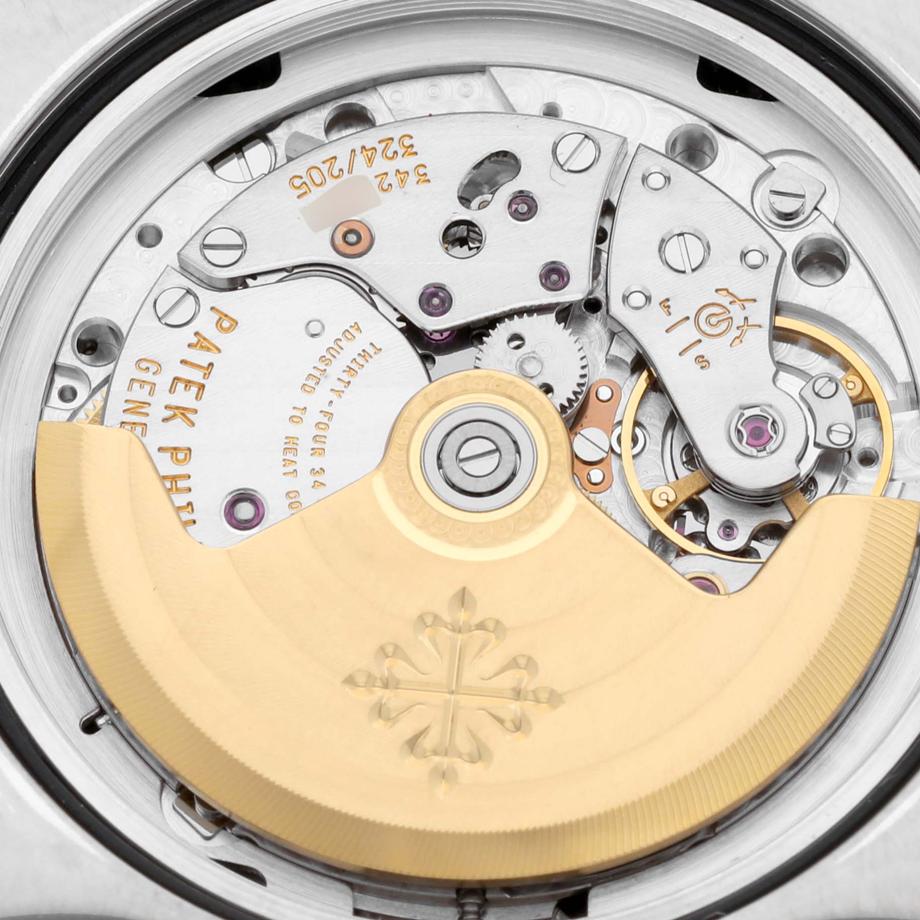 The image shows the intricate movement and internal mechanism of the Patek Philippe Gondolo 5135G-001 Men's White Gold Silver Dial 5135G-001 Men's White Gold Silver Dial watch from a close-up, rear angle.