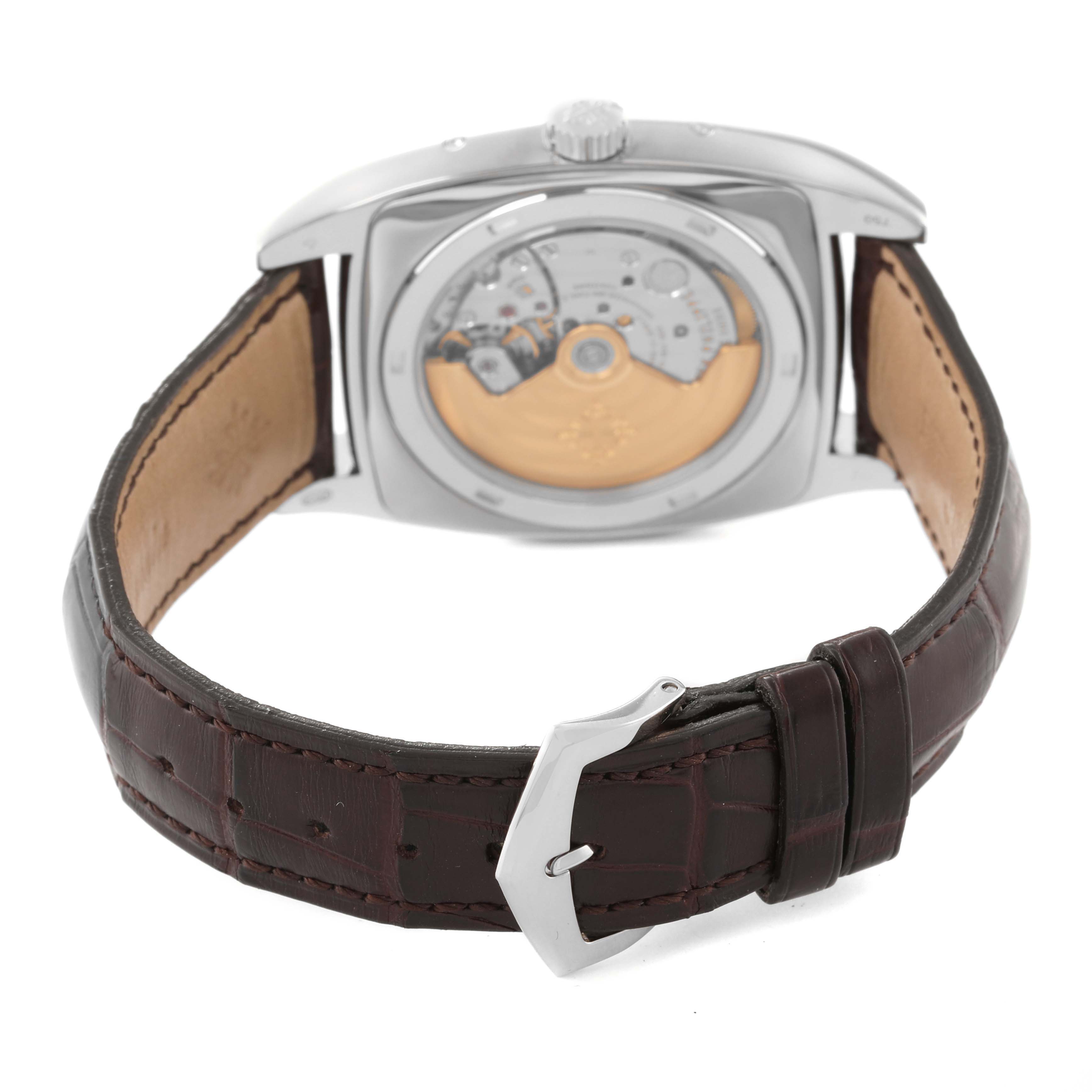 The image shows the back view of a Patek Philippe Gondolo 5135G-001 Men's White Gold Silver Dial 5135G-001 Men's White Gold Silver Dial watch, highlighting the movement and strap.