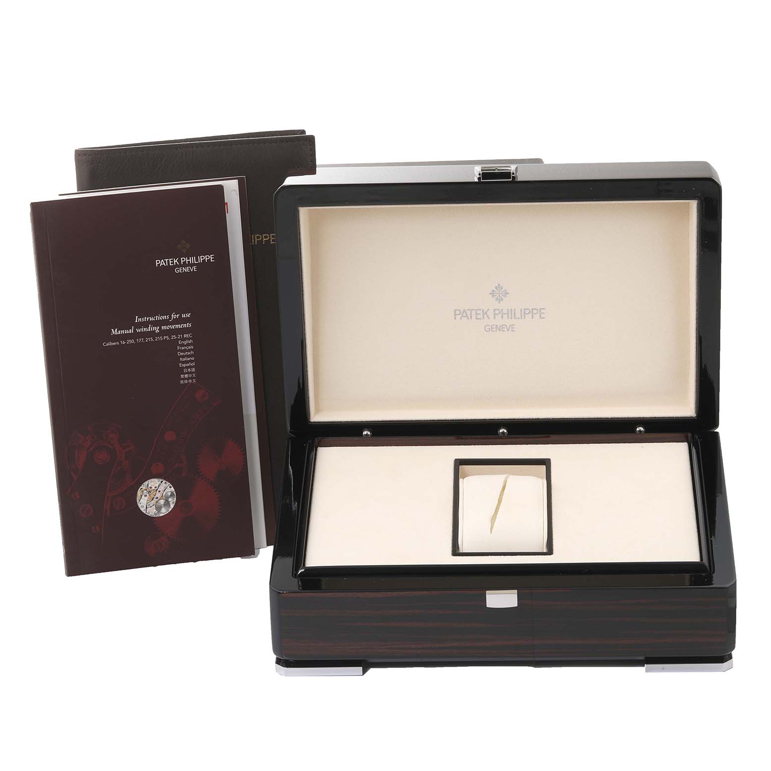 The image shows the packaging and manuals for a Patek Philippe Gondolo 5135G-001 Men's White Gold Silver Dial 5135G-001 Men's White Gold Silver Dial watch, including a presentation box and instruction booklets.