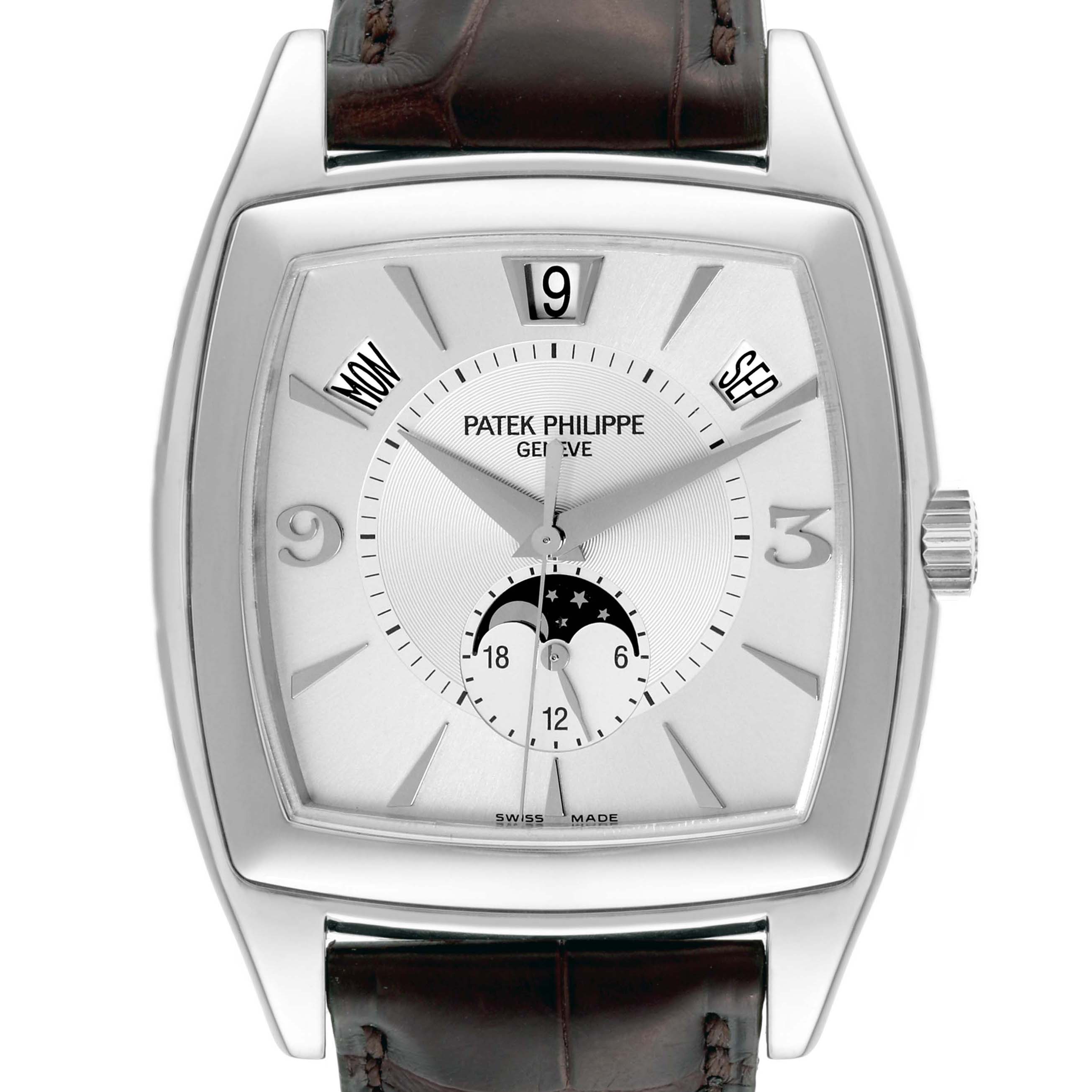 The image shows a frontal view of the Patek Philippe Gondolo 5135G-001 Men's White Gold Silver Dial 5135G-001 Men's White Gold Silver Dial watch, highlighting the dial, date, day, and month indicators, with part of the leather strap visible.