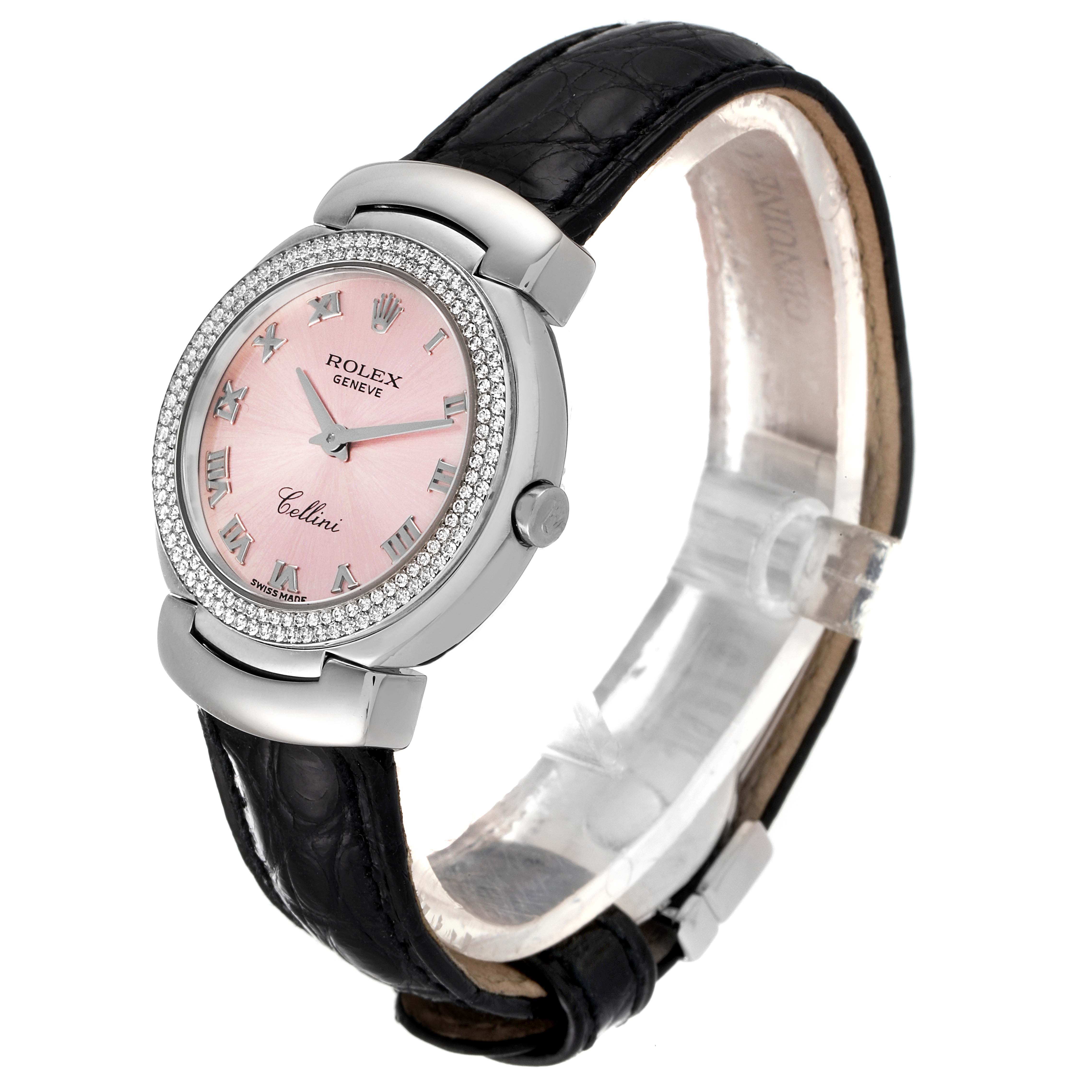 The Rolex Cellini 6671 Women's White Gold Pink Dial 6671 Women's White Gold Pink Dial watch is shown at a slight angle, displaying the pink dial, diamond-studded bezel, and black leather strap.