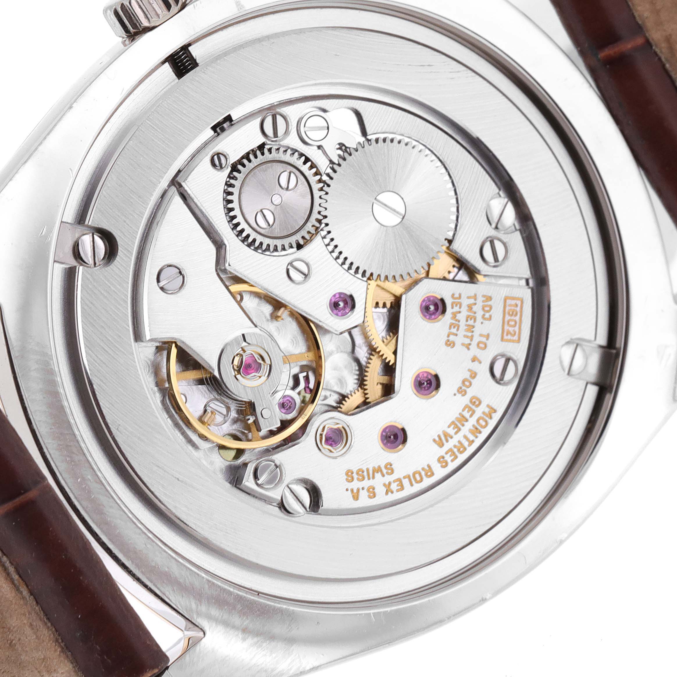 This image shows the back view of a Rolex Cellini 4233 Men's White Gold Black Dial 4233 Men's White Gold Black Dial watch, highlighting its intricate mechanical movement.