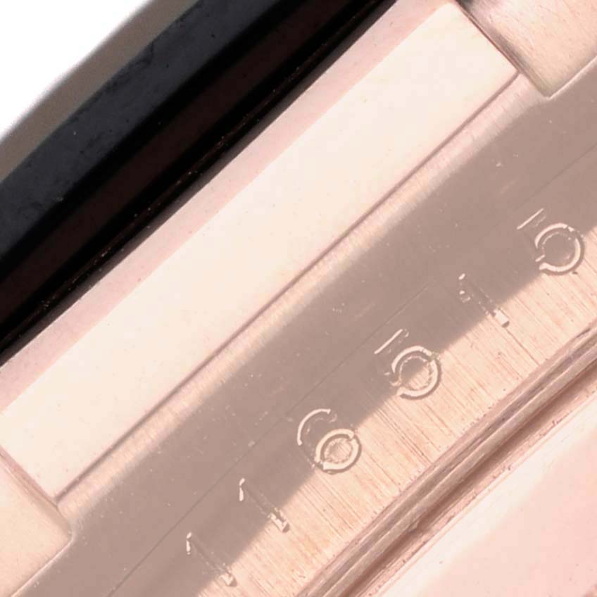 The image shows a close-up of the bezel on a Rolex Daytona 116515 Men's Rose Gold Black Dial 116515 Men's Rose Gold Black Dial watch, focusing on the engraved tachymeter scale.