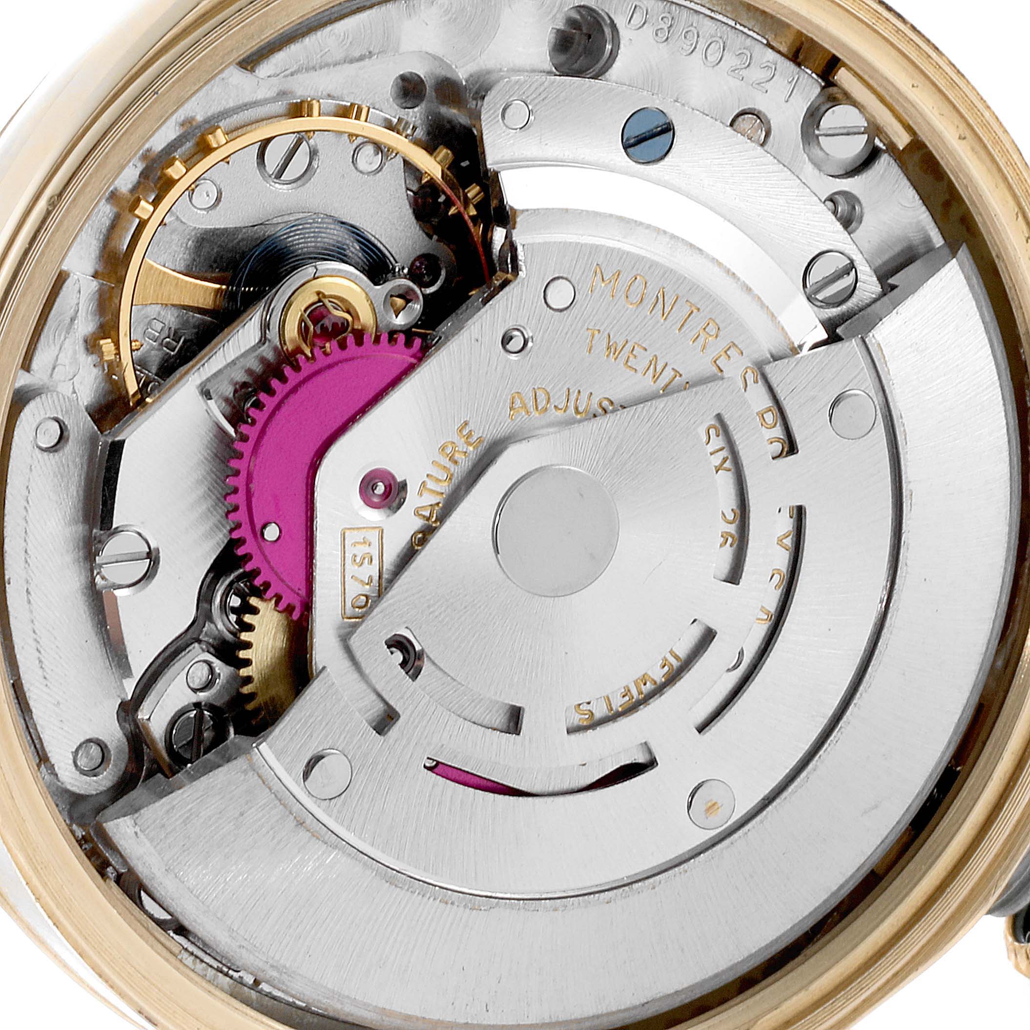 The image shows a macro view of the internal mechanism of the Vintage Collection model by Rolex.